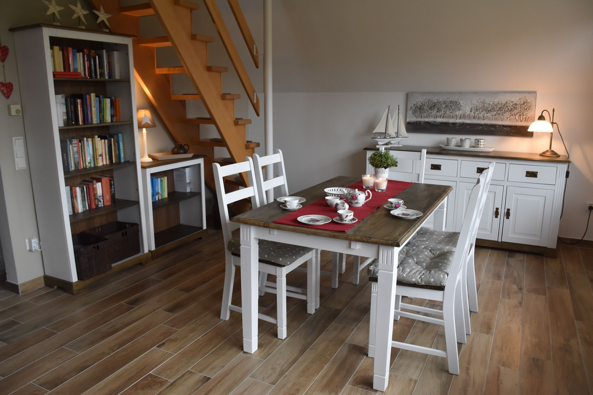 Ground floor: (Kitchen(TV, dining table(2 persons), hob(4 ring stoves, ceramic), toaster, coffee machine, oven, microwave, dishwasher, heating(electric)), Living/diningroom(TV(satellite), dining table(4 persons), radio, heating(electric)), bathroom(shower, washbasin, toilet))\n\nAttic: (bedroom(double bed, TV(satellite), heating(electric)), bedroom(2x single bed, heating(electric)))\n\ngrill, washing machine, terrace, garden furniture, parking, children\'s bed, high chair, ironing board, baby crib(free), Laundry Package for a fee