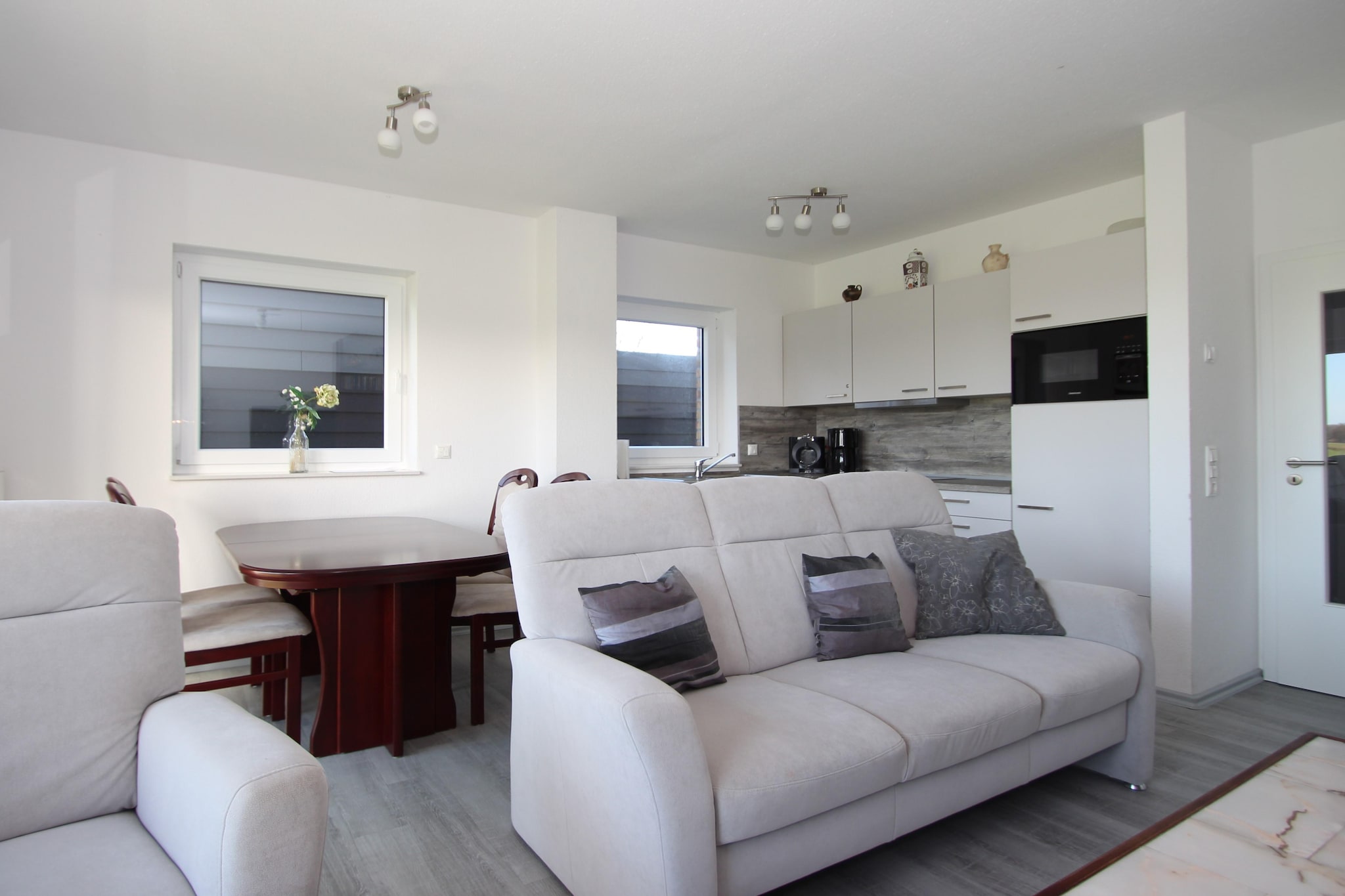 Ground floor: (open kitchen(hob(4 ring stoves, ceramic), electric kettle, toaster, hood, coffee machine, oven, microwave, dishwasher, fridge-freezer), Living/diningroom(TV(satellite), dining table, fireplace, DVD player, radio, CD player, stereo unit), guest toilet, terrace)\n\nOn the 1st floor: (bedroom(double bed(160 x 200 cm)), bedroom(double bed(160 x 200 cm)), bathroom(shower, sauna(private), washbasin, toilet))\n\nstorage, washing machine, balcony, heating(gas), garden furniture, parking