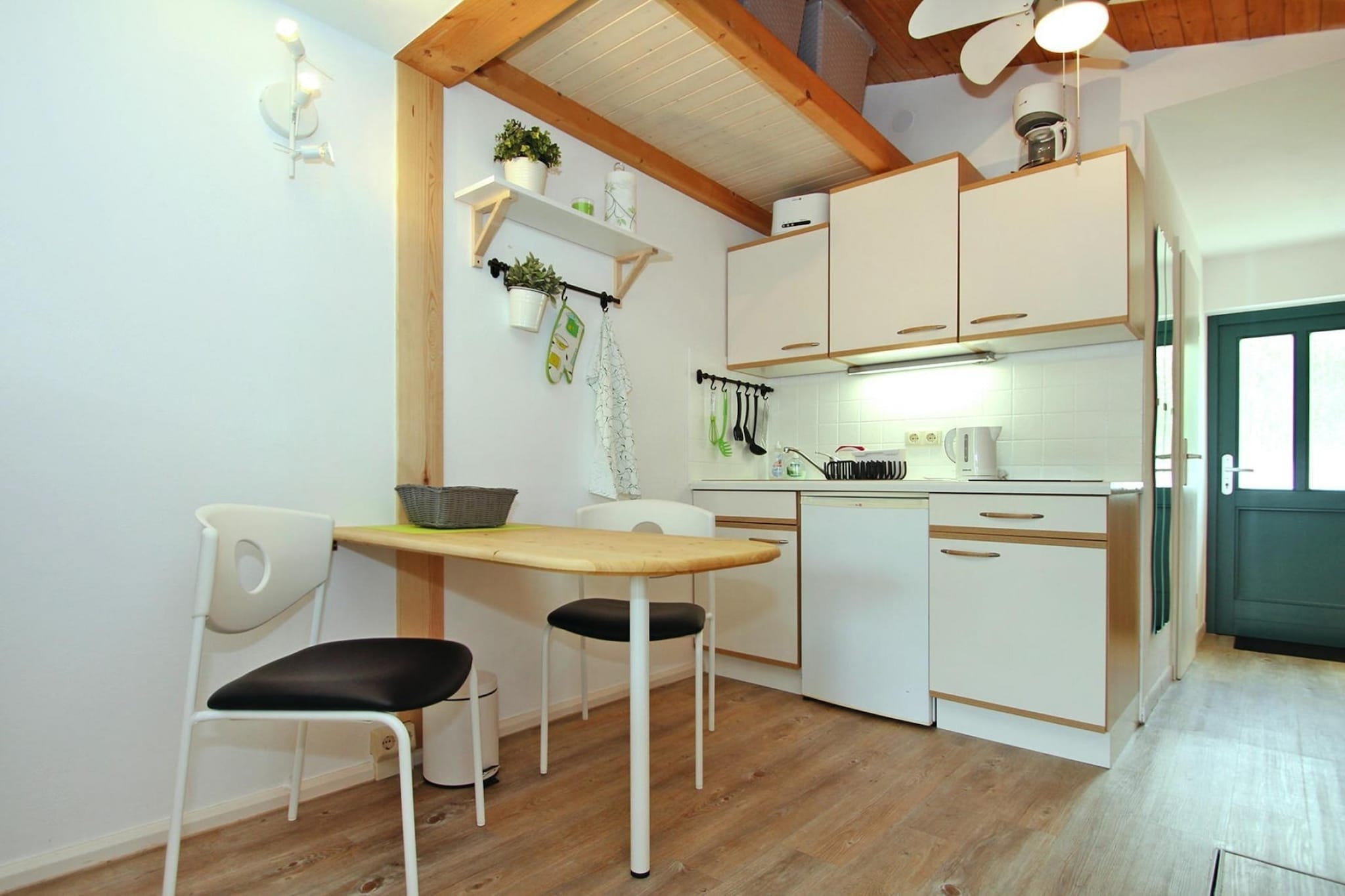 open kitchen(dining table, hob(2 ring stoves, electric), electric kettle, toaster, coffee machine, combination microwave, fridge), Living/bed room(double trundle bed, TV, radio, CD player), bathroom(shower, toilet), heating(electric), terrace(roofed), garden furniture, BBQ(electric), parking, Sheets for a fee