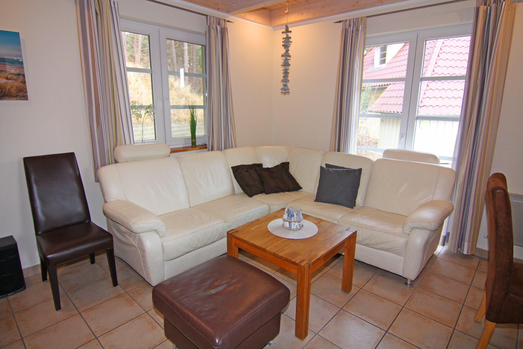 Ground floor: (open kitchen(dining table, hob(4 ring stoves, ceramic), electric kettle, toaster, hood, coffee machine, oven, microwave, dishwasher, fridge-freezer), Living/diningroom(TV(satellite), radio, CD player, heating(floor heating), heating(electric)), bedroom(double bed), bathroom(shower(walk-in shower), washbasin, toilet), Landing(washing machine))\n\nOn the 1st floor: (bedroom(double bed, TV), bedroom(2x single bed, TV), bathroom(shower, sauna(private), 2x washbasin, toilet), Landing)\n\nAttic: (open sleeping areas(single bed), single bed)\n\nterrace, garden furniture, parking, parking, high chair, baby crib(paid), Towels for a fee, Sheets for a fee