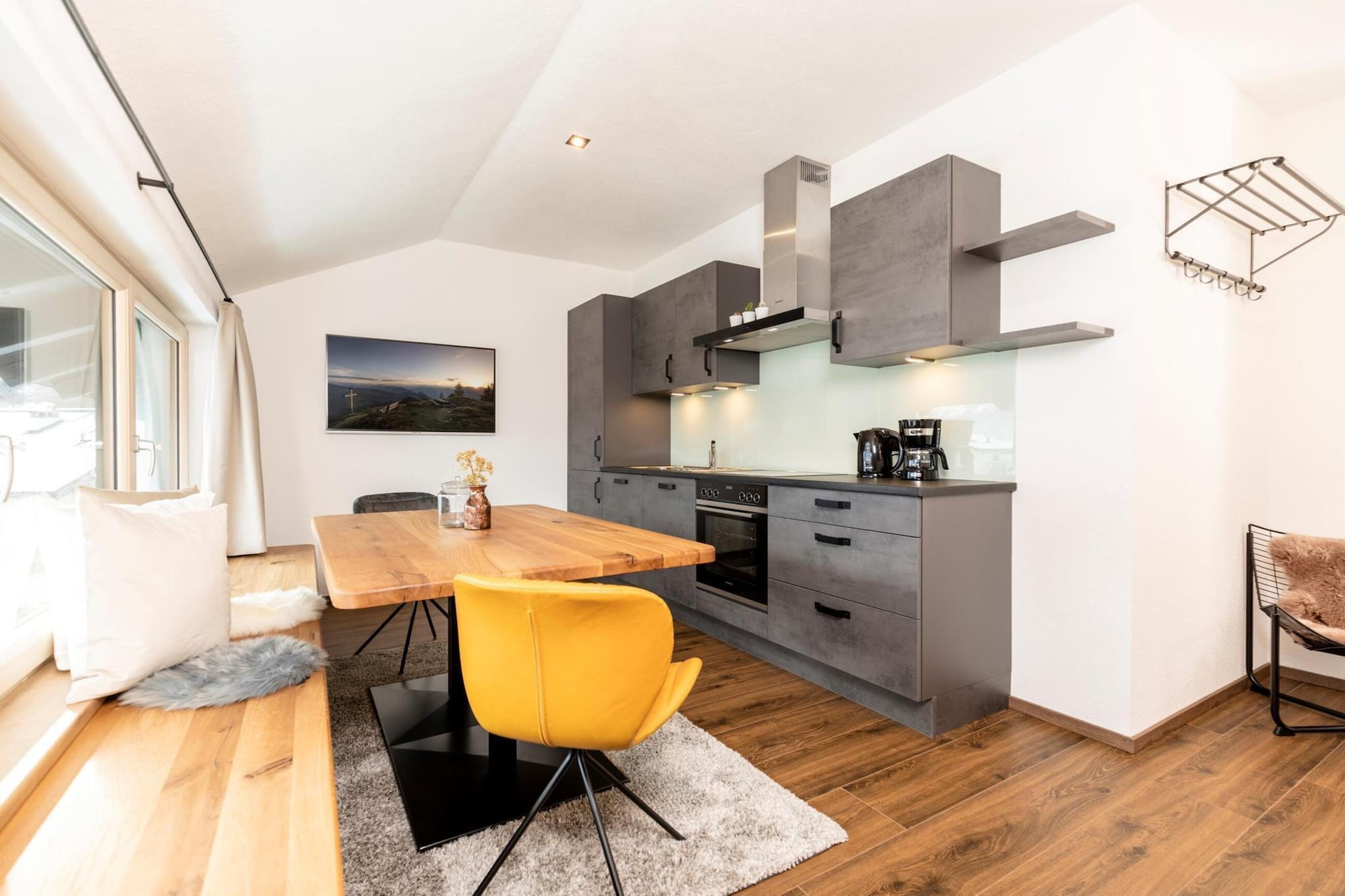 Attic: (Kitchenette(hob(ceramic), toaster, coffee machine, oven, microwave, dishwasher, fridge-freezer), Living/diningroom(TV(satellite)), bedroom(single bed, double bed), bedroom(single bed, single bed), bathroom(shower, toilet))\n\nbar, balcony, heating(floor heating), garden, garden furniture, parking, parasol, high chair, baby crib(free)