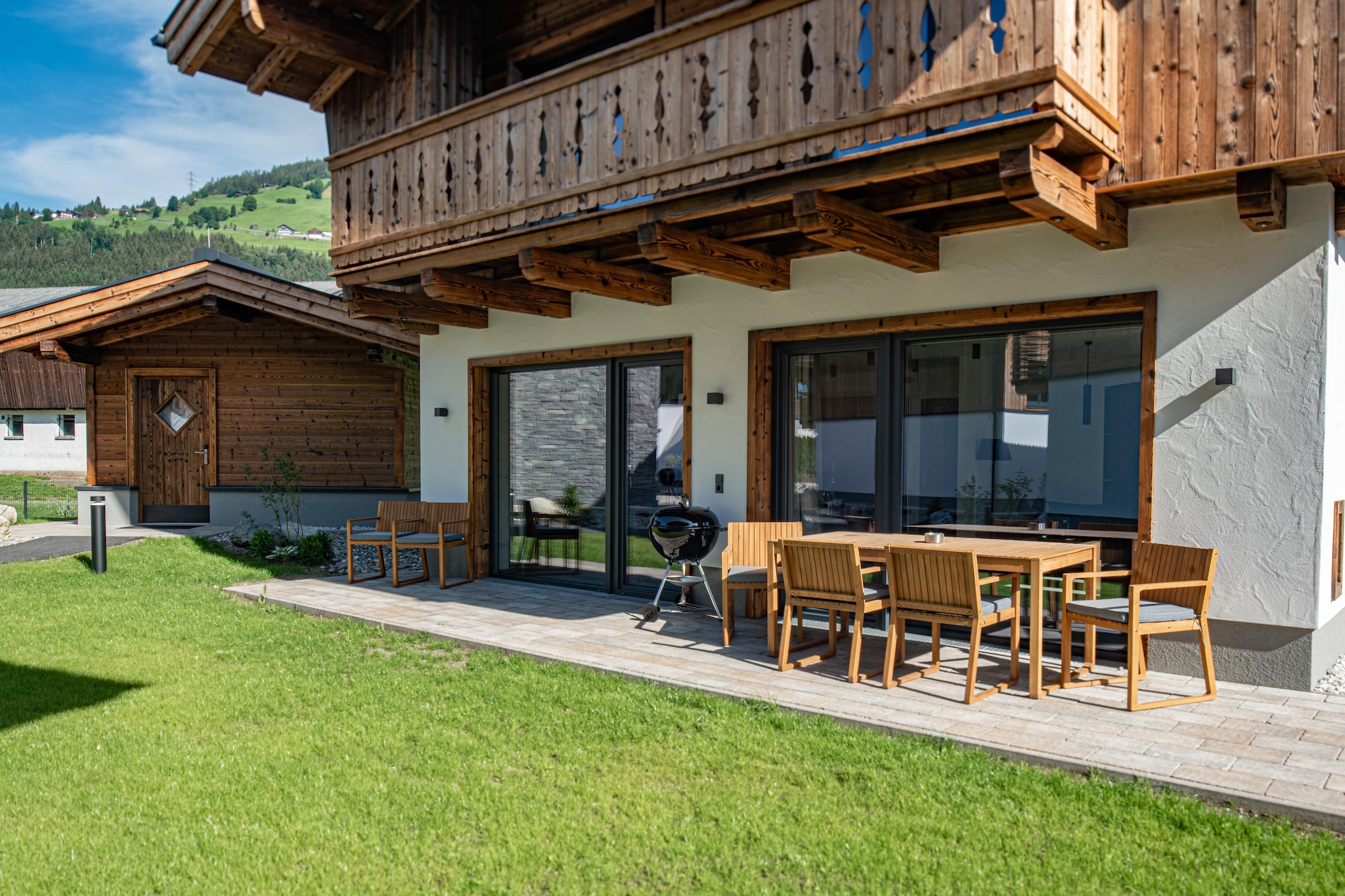 The small holiday village with cozy, lovingly furnished houses, each with a cozy Swedish stove is comfortably located in the middle of mountains. High-quality and modern furnished holiday homes in alpine style await you. All bedrooms have their own bathroom and a Smart TV with the streaming services Sky and Netflix. The small settlement was built sustainably with materials mostly from the area, whereby the connection to the history of the surrounding region has not been lost. Geothermal heat heats the entire facility and there are charging stations for electric cars in the carport (for a fee).  

Wald im Pinzgau (885 m above sea level) is located in Oberpinzgau at the foot of the Gerlos Pass between Mittersill and Krimml. Your holiday resort offers the perfect backdrop for relaxing holidays near the world-famous Krimml Waterfalls and the Großvenediger. Tyrol combined with the quiet atmosphere around the Salzburger Großvenediger is a perfect magic formula for your holiday!  In summer, the area around Tyrol is ideal for hiking and biking. When the weather is sunny, a round of golf at the golf course 25 km away is also worthwhile. Those looking for a little more action can explore the area by bike or go rock climbing.  

After a long day in the fresh air, the sauna house in the garden is also a popular meeting place. The sauna is available per chalet for 1 hour a day between 16:00 and 21:00 and can be reserved for use one day in advance. 

Please note that you must pay the obligatory final cleaning and tourism tax separately on site. The fees for this are displayed separately when booking.