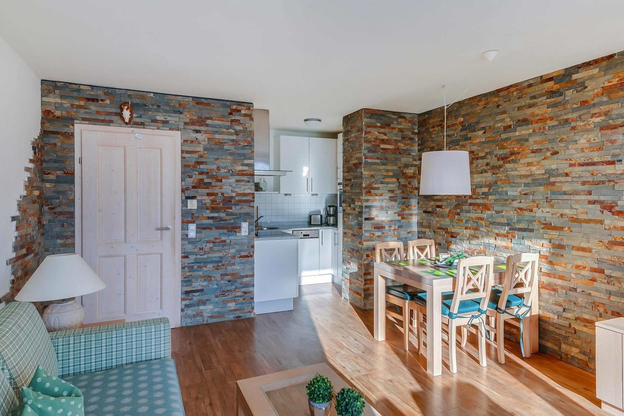 open kitchen(hob(4 ring stoves, ceramic), electric kettle, coffee machine, oven, microwave, dishwasher, fridge-freezer), Living/bed room(double sofa bed, TV(satellite)), bedroom(single bed, double bed), bathroom(bath tub, toilet), toilet, balcony, heating(floor heating), garden furniture, parking, high chair, baby crib(paid)