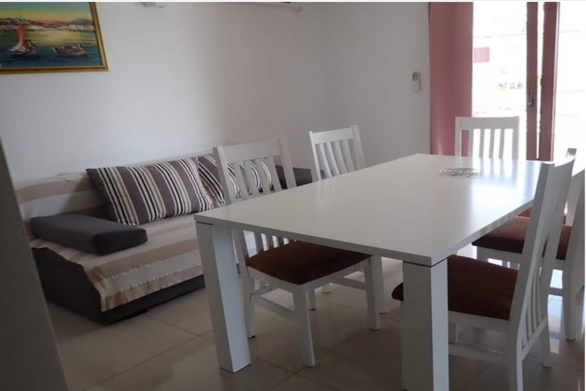 On the 2nd floor: (Living room(double sofa bed, TV(satellite), seating area), open kitchen(dining table, hob(2 ring stoves, ceramic), coffee machine, fridge-freezer), bedroom(double bed), Gallery bedroom(2x single bed, shower, toilet, balcony), bathroom(shower, toilet), washing room(washing machine(shared with the the owner and other guests), ironing board, iron))\n\nbalcony, air conditioning, terrace(private), parking
