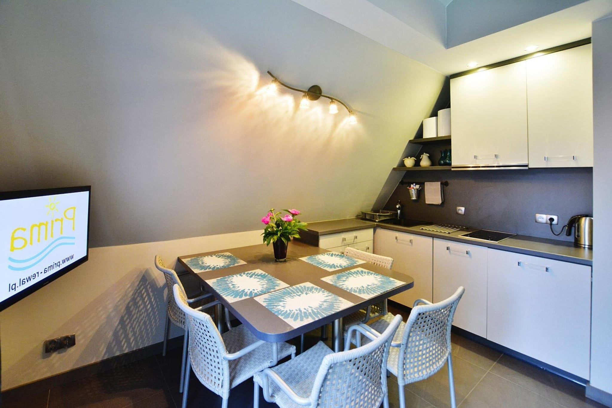 On the 1st floor: (open kitchen(hob(2 ring stoves, electric), electric kettle, coffee machine, dishwasher, fridge-freezer), Living/diningroom(double sofa bed, TV(flatscreen, german television channels), dining table(5 persons)), bedroom(single bed, double bed), bedroom(single bed, single bed), bathroom(shower, washbasin, toilet, hairdryer))\n\nReception, Internet access, Play area, Lawn, washing machine(shared with other guests, paid), balcony, heating(central, floor heating), garden(shared with other guests, fenced, 3000 m2), garden furniture, sun loungers, BBQ(charcoal), parking, trampoline(shared with other guests), parasol, sand pit(shared with other guests), slide(shared with other guests), table tennis table(shared with other guests), table football(shared with other guests), fitness equipment(shared with other guests), high chair, ironing board, iron, Swing set, baby crib(free)