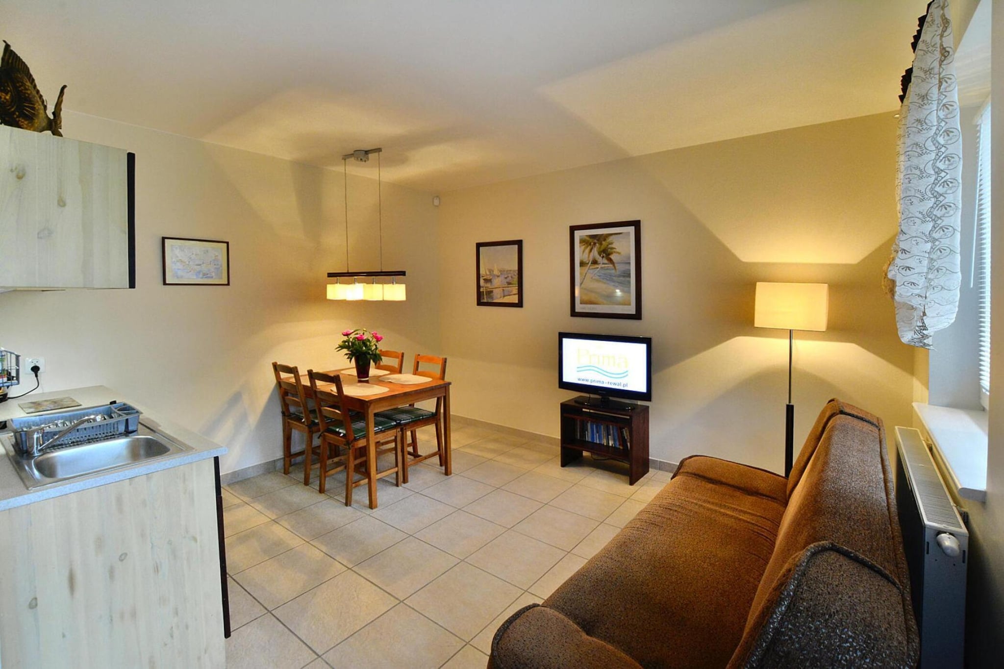 Recreation complex in Rewal, very close to the sea and the center of the resort. Only 150 m to the beach. Elegant and cozy apartments await you on the fenced property. There is a reception and parking on site.
A 2-level, 3-room apartment designed for 4 people. There are 2 separate bedrooms on the first floor. On the ground floor there is a living room with a kitchenette. Bathroom with shower. In the living room, in addition to the table and TV, there is also a fold-out sofa where an additional person can sleep. Wireless internet is available. Central heating. The apartment has access to the terrace with garden furniture.
There is access to a washing machine on site (for an additional fee). There is a playground with a trampoline for the youngest guests. Recreation enthusiasts will enjoy table tennis, table football and fitness equipment.
The price of the stay includes: bed linen, electricity and water consumption, internet, parking, final cleaning.
Rewal is a holiday resort in the West Pomeranian Voivodeship. It is located on the shores of the Baltic Sea and is the center of the picturesque Rewal Coast. It offers a clean beach and a guarded swimming area. Being near the beach, you must see the symbol of the town. These are the huge Rewal Whales standing on the promenade right next to the coast and on the viewing platform.
Children will be delighted with a visit to the Whale Park, with real sea giants, and to the Fairy Tale Cottage, where they will meet face to face with fairy-tale characters. In bad weather, an ideal option will be a trip to one of several public indoor swimming pools. The Gibon Rope Park will also be fantastic entertainment for the whole family or a group of friends, offering a lot of obstacles to overcome suspended high in the treetops. Of course, with appropriate protection.
The pride of the town is the renovated narrow-gauge railway, which allows you to go on a charming trip to neighboring resorts.