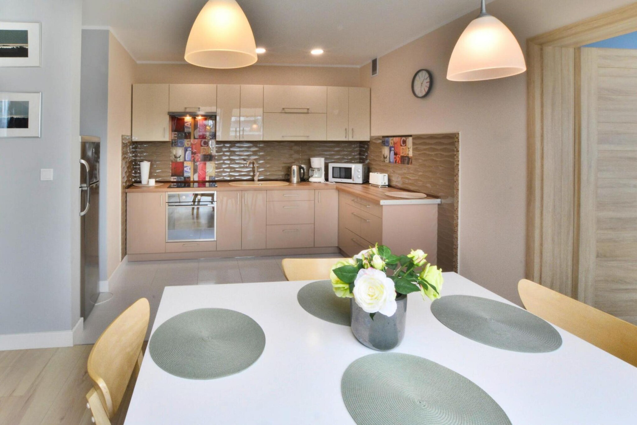 On the 2nd floor: (open kitchen(hob(4 ring stoves, induction), electric kettle, toaster, coffee machine, oven, microwave, fridge-freezer), Living/diningroom(double sofa bed, TV(flatscreen, digital), dining table(4 persons)), bedroom(double bed, TV(flatscreen, digital)), bathroom(shower, washbasin, toilet, washing machine, hairdryer))\n\nbalcony, heating(central), bicycle storage, garden furniture, parking, high chair, ironing board, iron, baby crib(free)