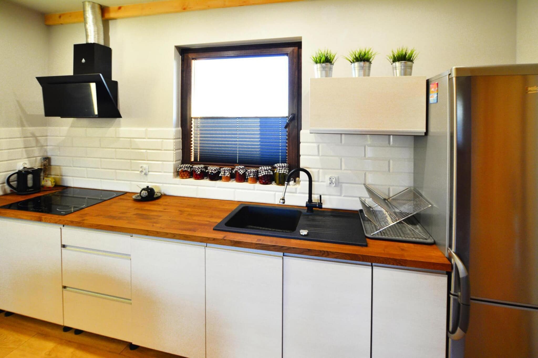 Ground floor: (open kitchen(hob(4 ring stoves, electric), electric kettle, hood, coffee machine, oven, dishwasher, fridge-freezer), Living/diningroom(double sofa bed, TV(flatscreen, satellite, smart TV, german television channels), dining table(8 persons), DVD player, CD player), bedroom(double bed, TV), bathroom(shower, washbasin, toilet, washing machine, hairdryer))\n\nOn the 1st floor: (bedroom(2x single bed), bedroom(double bed, TV), bedroom(double bed), bathroom(shower, washbasin, toilet))\n\nReception, Internet access, Play area, Lawn, baby bath, Bubble bath(shared with other guests, outside, heated with fire), sauna(shared with other guests, 15 persons), heating(central), terrace(roofed), garden(shared with other guests, fenced, 3000 m2), garden furniture, sun loungers, BBQ(charcoal), parking, trampoline(shared with other guests), parasol, sand pit(shared with other guests), play equipment(shared with other guests), slide(shared with other guests), bicycles available, hammock, high chair, ironing board, iron, Garden shed, Swing set, baby crib(free)