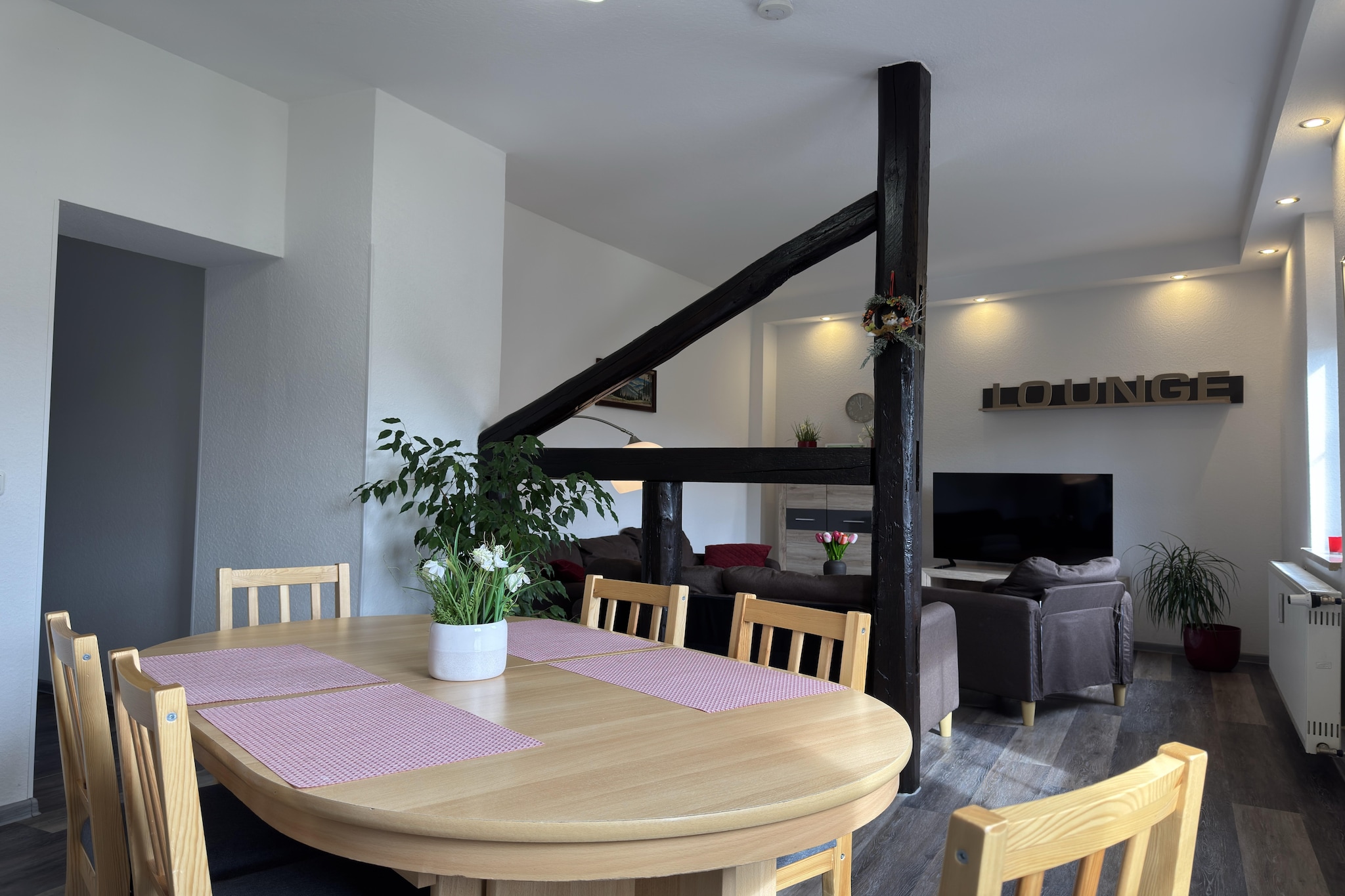 This welcoming ground-floor apartment in Cattenstedt offers a cozy stay just steps from the village center. Perfect for families, it’s ideally located to explore the Harz region’s highlights. Nearby attractions include the dramatic Devil’s Wall rock formation, the majestic Blankenburg Castle, and the thrilling Titan RT suspension bridge. Nature lovers can venture into Harz National Park or visit the caves of Rübeland for underground wonders.

The apartment features two bedrooms—one with a double bed and satellite TV, the other with two single beds and a bunk bed—plus a spacious living/dining room with a flatscreen TV and seating area. The fully equipped kitchen includes a ceramic stove, oven, microwave, dishwasher, and coffee machine. Two bathrooms, a washing machine, central gas heating, a cot, high chair, toys, and party games ensure a comfortable and family-friendly experience.

Surrounded by forest trails and close to lakes, ski slopes, and public transport, the location is ideal for year-round adventure. Dining options nearby include the elegant Das Welfenzimmer, the rustic Zum Alten Forsthaus Todtenrode, and the hearty Gaststätte Großvater.