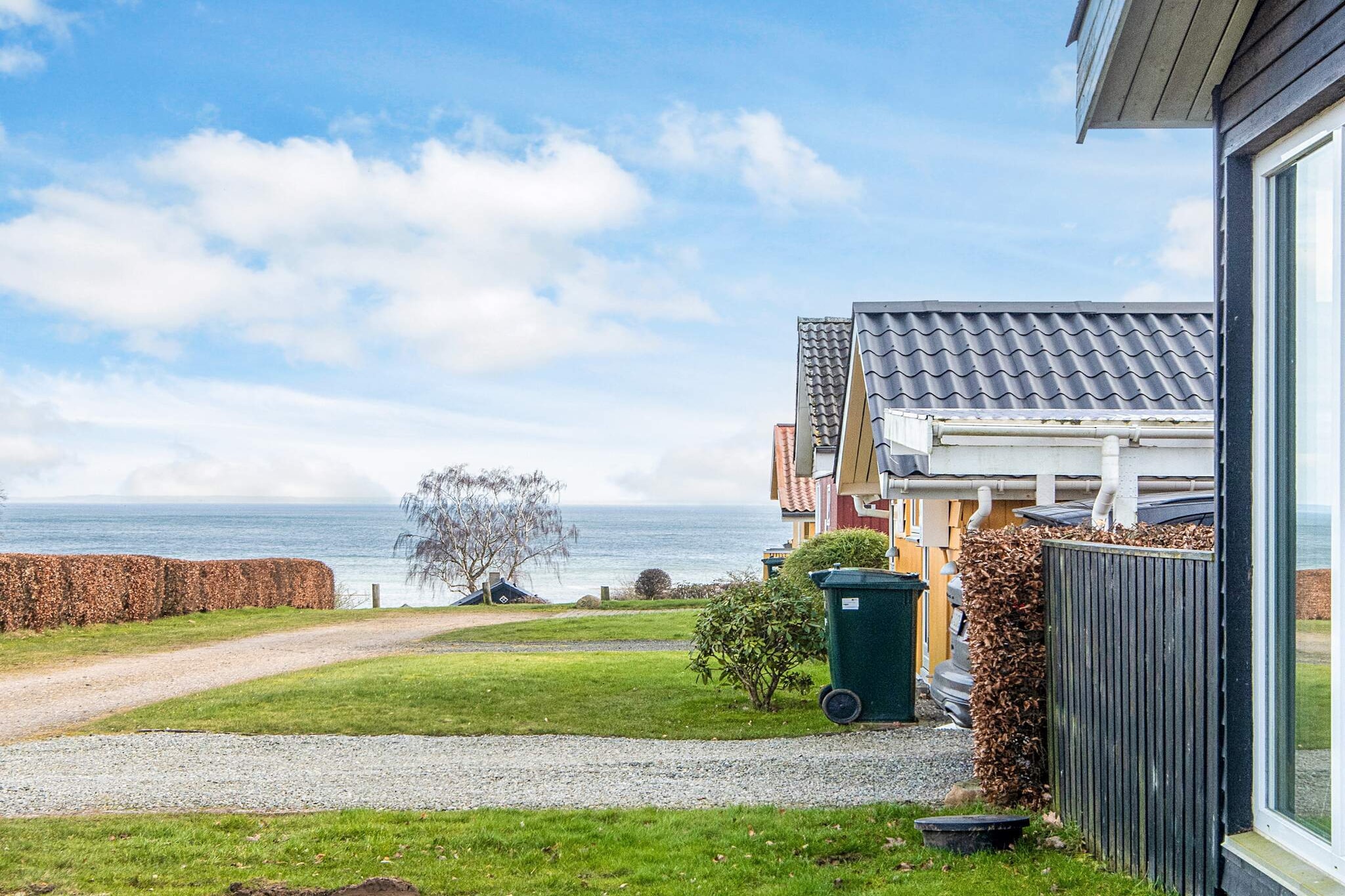 In Binderup you will find this holiday home located high in one of the east coast's most lovely holiday home areas with a lovely view of the Little Belt. After a perhaps active day you can relax in the outdoor wilderness pool, which is equipped with a spa function and in the evening the water is illuminated by colored lights in the water. The summer house is furnished with a pitched ceiling and facing the water, the large windows make the house very bright. From the large kitchen/dining room and the living room you have the most beautiful view of the water. The house's TV has Chromecast installed so you can cast your own streaming services, as well as the small Norlys TV package installed on the Chromecast. There are four separate bedrooms as well as a loft and bathroom with underfloor heating. The house is almost surrounded by terraces, where you can enjoy the outdoors with, for example, barbecues and games and enjoy the view of the water. On the terrace facing south/west you can relax in the lovely lounge set and when the dew falls, you can pull out the electric awning and enjoy a small glass of bubbles and jump in the wild pool, which is heated with wood. There is a swing and in the area you will find several playground areas and ball fields. Not rented to youth groups.A refundable deposit might be charged closer to your check-in date. The security deposit ensures a smooth stay and covers any additional services or consumption charges.This deposit covers utilities consumed during your stay and any additional services that may be taken.The final amount will be adjusted based on actual meter readings, actual usage of extra services, and any remaining balance will be refunded within 21 days after checkout.This deposit simply acts as a prepayment for charges that  you would anyways pay for, ensuring a seamless stay and check-out experience.