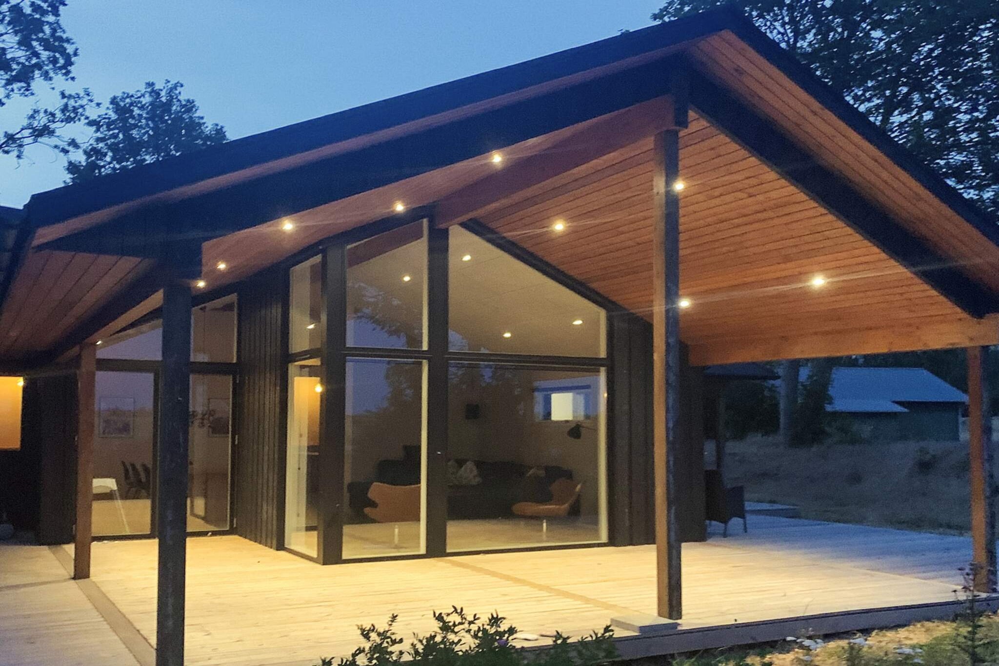 At Falsled you will find this holiday home from 2021 with whirlpool and sauna located on a 1200 m2 natural plot with panoramic views of the sea. From the house there is a private path down to the water. Both from the house and the terrace there is a beautiful view of the water and the entire coastline. The well-equipped kitchen department has i.a. dishwasher, ceramic hob and microwave. There is a large, combined living / dining room furnished with furniture of Danish quality and a large TV with Chromecast, so you can stream your own services. There is fiber network in the house. There are two bathrooms, one of which has a large whirlpool with room for 5 people and a beautiful sauna with a large view window overlooking the water. There is a washing machine. The house can accommodate 12 guests with four bedrooms divided into three with double beds and one with double bed as well as a bunk bed. There is additional space for two people on the large loft of the house. There is a high chair and cot for the little holiday guests. From the living room there is direct access to the large, covered / open terrace with garden furniture and barbecue. The house is located only 145 m from the coast, which is perfect for i.a. windsurfing and kayaking along the beautiful coastline. In the town you will find Falsled Kro, which is one of Denmark's absolute best restaurants and a small harbor, where there is at times the opportunity to buy freshly caught fish. Not for rent to youth groups.

A refundable deposit might be charged closer to your check-in date. This deposit covers utilities consumed during your stay and any additional services that may be taken. The final amount will be adjusted based on actual meter readings, actual usage of extra services, and any remaining balance will be refunded within 21 days after checkout.