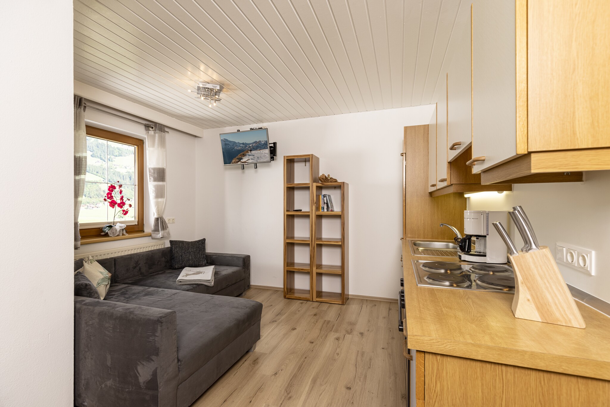 On the 2nd floor: (Large kitchen(dining table, seating area, cooker(4 ring stoves), coffee machine, oven, microwave, fridge-freezer, washbasin), bedroom(double bed), bedroom(double bed), bathroom(shower, washbasin, toilet))\n\nTV, stove, ski boot heaters, balcony, heating, terrace, garden, bicycle storage, BBQ, parking, parasol, children\'s bed