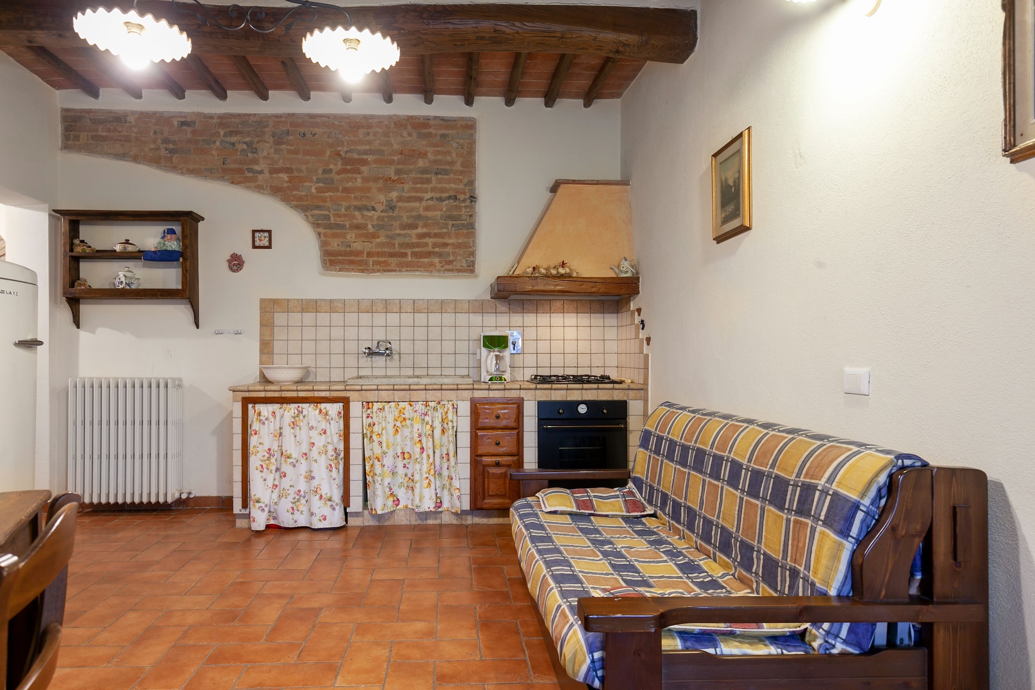 Ground floor: (open kitchen(hob, boiling water tap, hood, coffee machine, oven, fridge), Living/diningroom(double sofa bed, TV, dining table), bedroom(double bed), bedroom(double bed), bathroom(shower, washbasin, toilet, bidet), bathroom(shower, washbasin, toilet, bidet))\n\nwashing room(washing machine, ironing board, iron), recreation room(table tennis table, table football), heating, terrace(private, 10 m2), garden, garden(shared with other guests), garden furniture, swimming pool(shared with other guests, outside, 14 x  7 m., opened from 1/2 Apr upto and including 1/2 Sep)