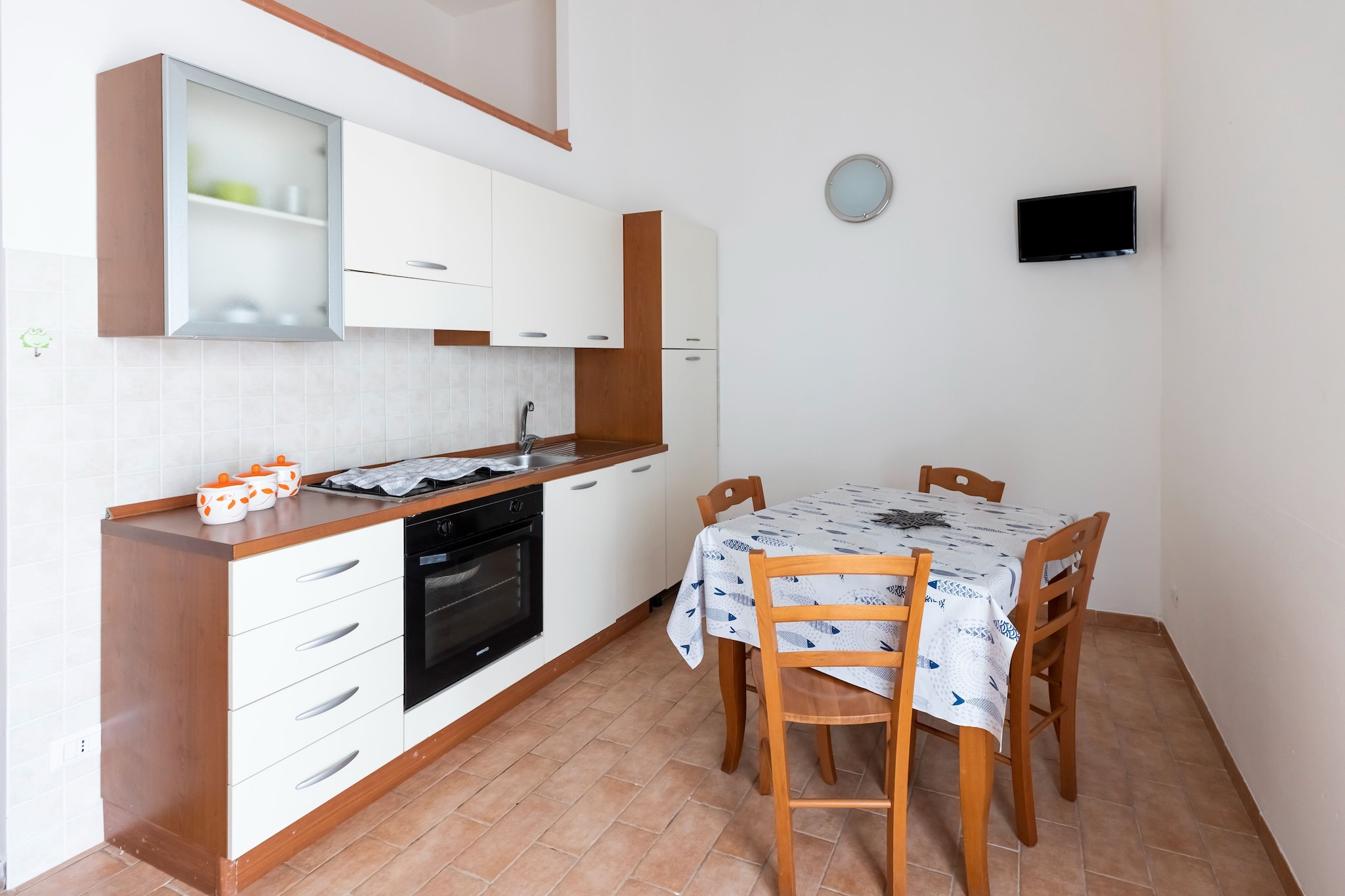 Ground floor: (Kitchen(TV, dining table, hob, boiling water tap, cooker, hood, coffee machine, oven, fridge), Living/bed room(double sofa bed, TV, dining table, seating area), bedroom(single bed, single bed, double bed), bathroom(shower, washbasin, toilet, bidet, hairdryer))\n\nsolarium, air conditioning, terrace, garden, BBQ, parking, swimming pool(shared with other guests)