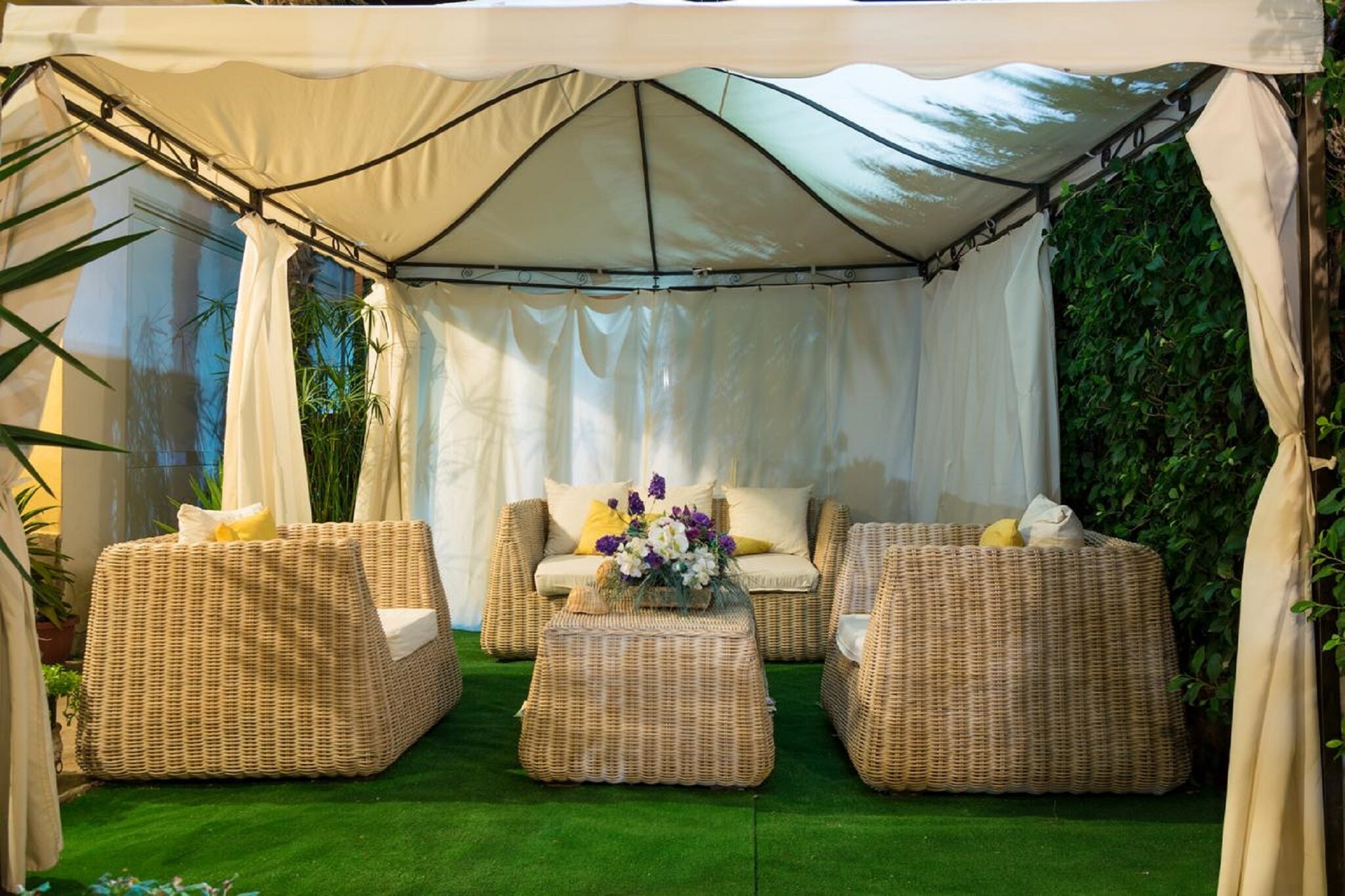 Ground floor: (Living room(reachable from the outside)(seating area), Kitchen(reachable from the outside)(dining table, hob, cooker, espresso machine, fridge), Bedroom with bathroom(single folding bed, double bed, TV, shower, washbasin, toilet, bidet, air conditioning, hairdryer), Bedroom with bathroom(double bed, TV, shower, toilet, bidet, air conditioning, hairdryer), Bedroom with bathroom(double bed, shower, washbasin, toilet, bidet, hairdryer))\n\noutdoor kitchen, heating, air conditioning, terrace, garden, garden furniture, BBQ, parking lot(public)