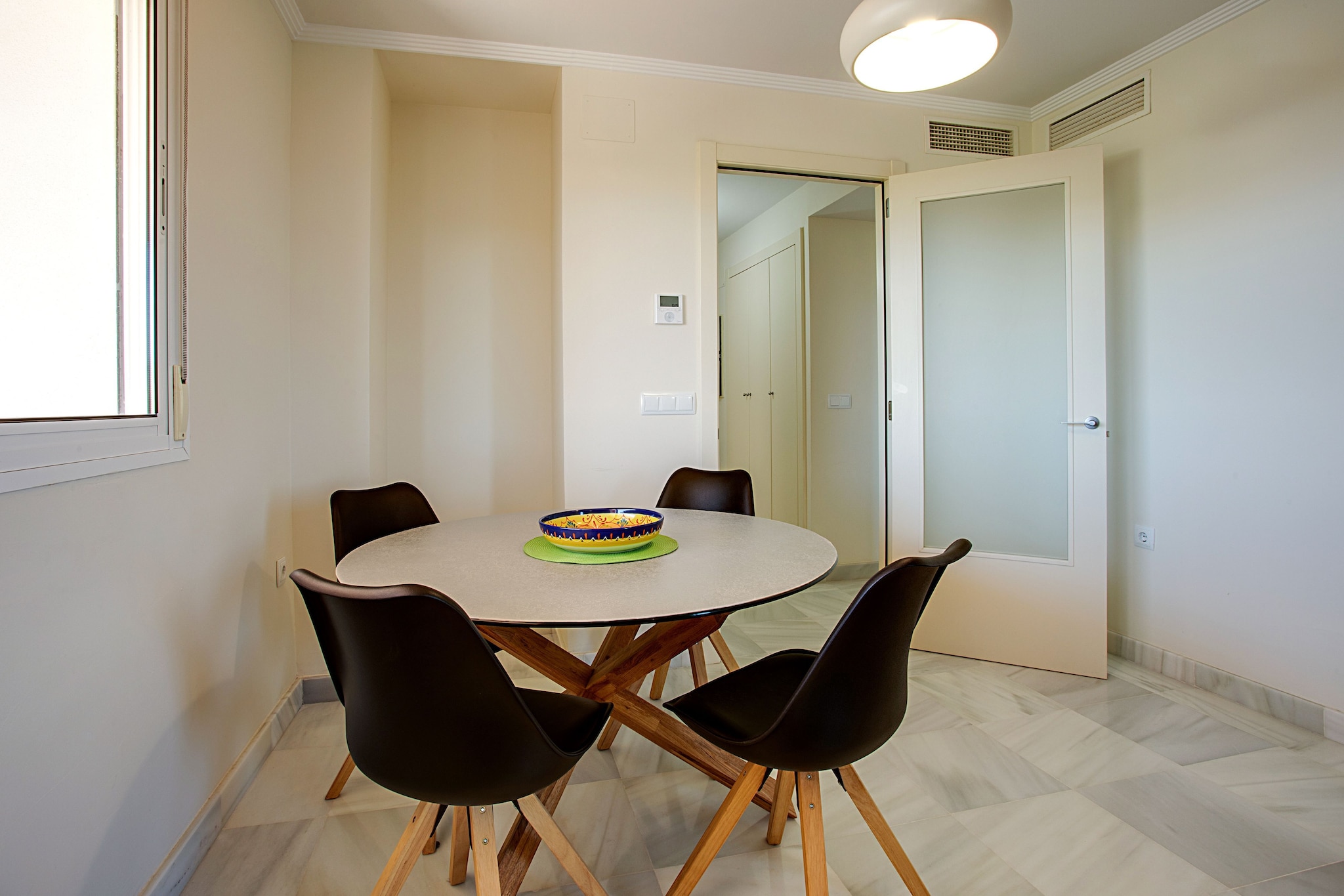 Ground floor: (Kitchen(electric kettle, toaster, cooker, coffee machine, oven, microwave, dishwasher, fridge, freezer, washing machine), Living/diningroom(TV, dining table(4 persons), seating area, heating, air conditioning), bedroom(double bed, balcony or terrace, air conditioning), bedroom(single bed, single bed, balcony or terrace, air conditioning), bathroom(bathtub or shower, washbasin, toilet), bathroom(shower, toilet))\n\nterrace(private), garden(shared with other guests), garden furniture(4 persons), parking, swimming pool(shared with other guests)