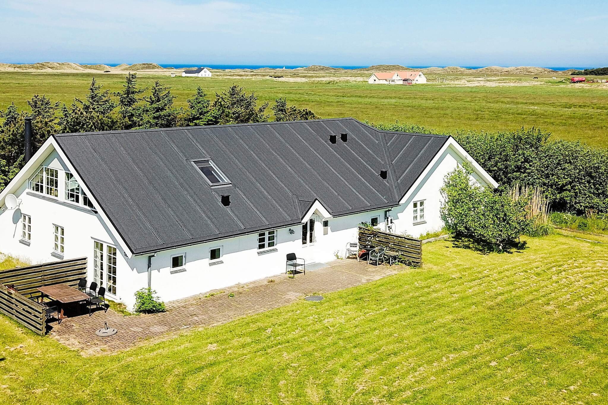 open kitchen(cooker(electric), hood, coffee machine, microwave, dishwasher, fridge, fridge-freezer), Living/bed room(TV(satellite, german television channels, danish TV channels (DR1 and TV2)), DVD player, CD player, stereo unit, high chair), bedroom(double bed, children\'s bed), bedroom(double bed), bedroom(double bed), bedroom(single bed), bedroom(single bed), bedroom(2x single bed), bathroom(floor heating)(tumble dryer, bathtub or shower, washbasin, toilet, washing machine), bathroom(floor heating)(bathtub or shower, washbasin, toilet), carport, sauna(indoor, 4 persons), terrace, BBQ, geothermal energy, geothermal energy, solar energy