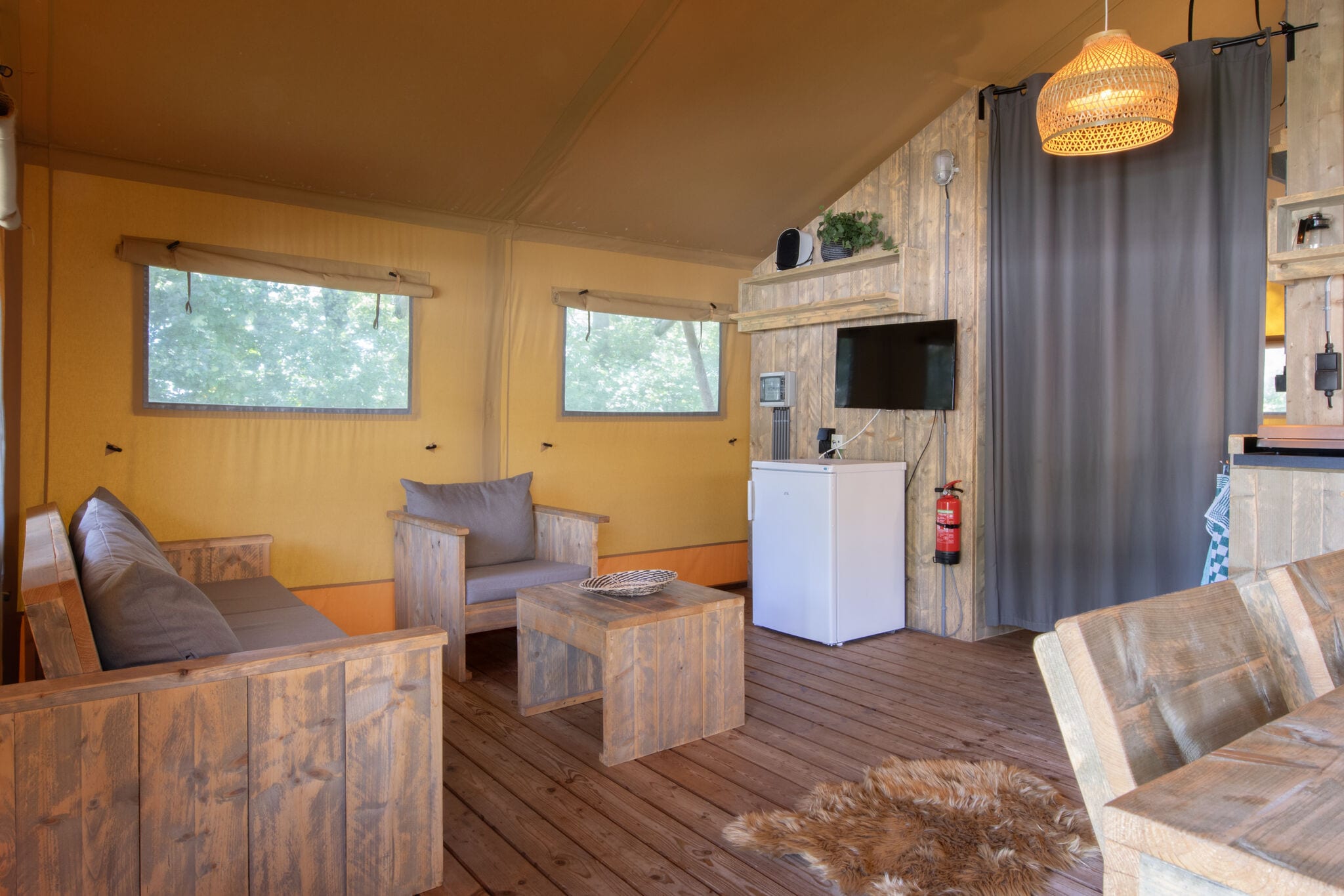 Comfortable safari tent with bathroom, on a holiday park in De Maasduinen