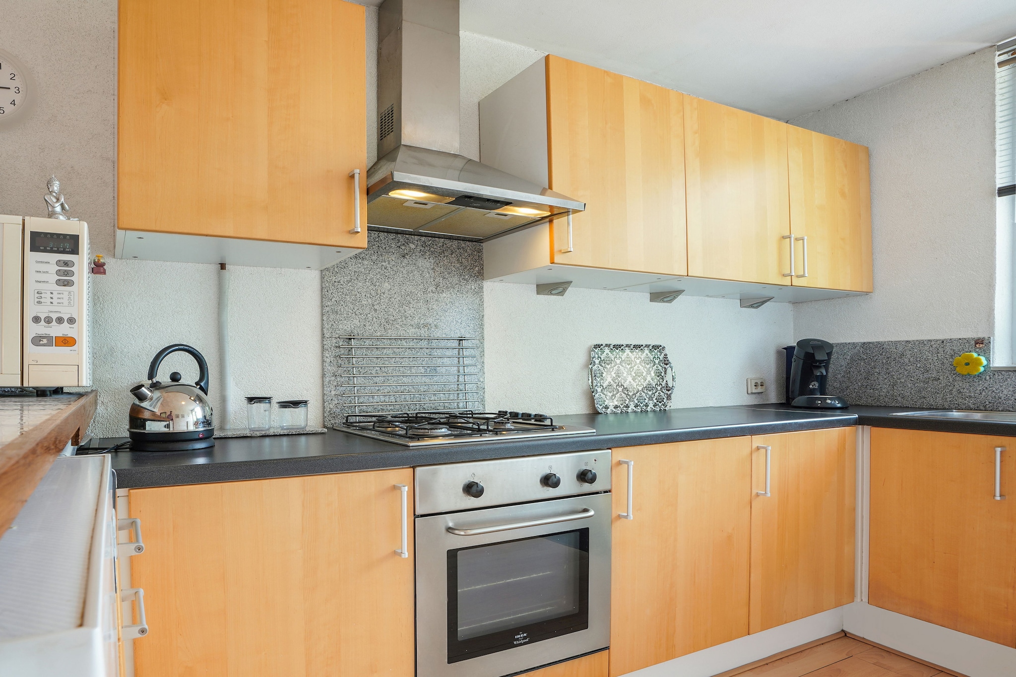 Ground floor: (Living room(TV, seating area), dining room(dining table), Kitchen(electric kettle, coffee machine, oven, microwave, fridge-freezer), bedroom(double bed), bathroom(bath tub, shower, washbasin), toilet, hall)\n\nterrace, garden, parking lot(public)