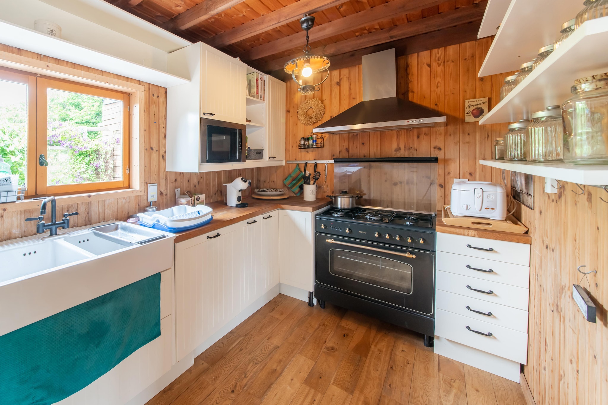 Ground floor: (Living room(single bed, single sofa bed, TV, radio), dining room(dining table), Kitchen(cooker, coffee machine, oven, microwave, fridge-freezer), bedroom(double bed), bathroom(shower, toilet, bidet))\n\nOn the 1st floor: (mezzanine(single bed, single bed, single bed, single bed))\n\nTV, coffee machine, dishwasher, heating, terrace, garden, garden, garden furniture, parking, deckchairs