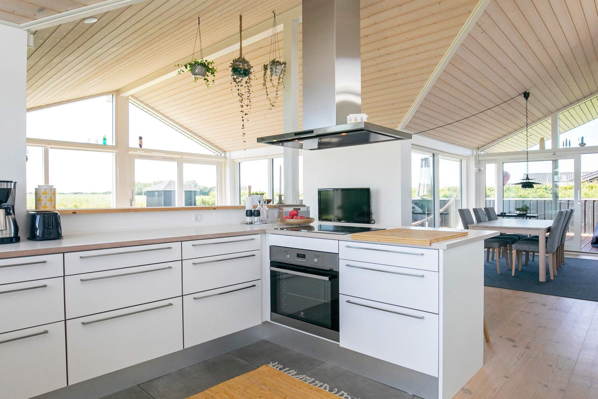 open kitchen(cooker(electric), hood, coffee machine, microwave, dishwasher, fridge-freezer), Living/bed room(TV, radio, chromecast), bedroom(double bed), bedroom(double bed), bedroom(2x single bed), bathroom(floor heating)(bathtub or shower, washbasin, toilet, washing machine), mezzanine(3x single folding bed), heating(electric), terrace, garden, BBQ, air to air heatpump