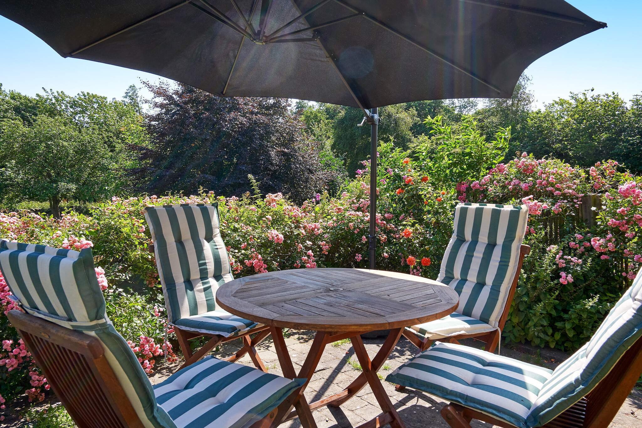 Holiday apartment located in the eastern part of the main building on a country estate in Østermarie. The apartment contains an entrance hall, large kitchen with dining area and exit to the terrace overlooking the garden that goes down to the creek. Owner lives in the other part of the main building. The dining kitchen and living room are separated by beautiful French doors. The living room has a wood burning stove, a cozy sofa arrangement and a double bed. Dining kitchen and living room face south. To the north is the bathroom and bedroom with double bed. The holiday apartment is located in beautiful rural surroundings. Owner's horses walk on the loops around the property. The large garden is the owner's, but can be used by agreement with the owner. Not for rent to youth groups.