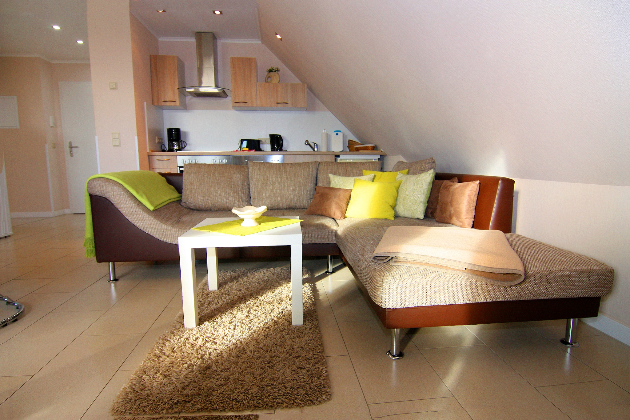 On the 1st floor: (open kitchen(dining table, toaster, cooker(4 ring stoves, ceramic), hood, coffee machine, oven, dishwasher, fridge(+ freezer), washing machine), Living/diningroom(TV(satellite), radio), bedroom(double bed), bedroom(2x single bed), bathroom(bath tub, shower, washbasin, toilet), toilet(guest toilet), balcony)\n\nAttic: (bedroom(double bed, TV(satellite)), bedroom(double bed), bathroom(shower, washbasin, toilet))\n\nseating area, grill, heating(central, floor heating), garden furniture, parking, high chair, baby crib(free), Towels/Sheets (extra fee)