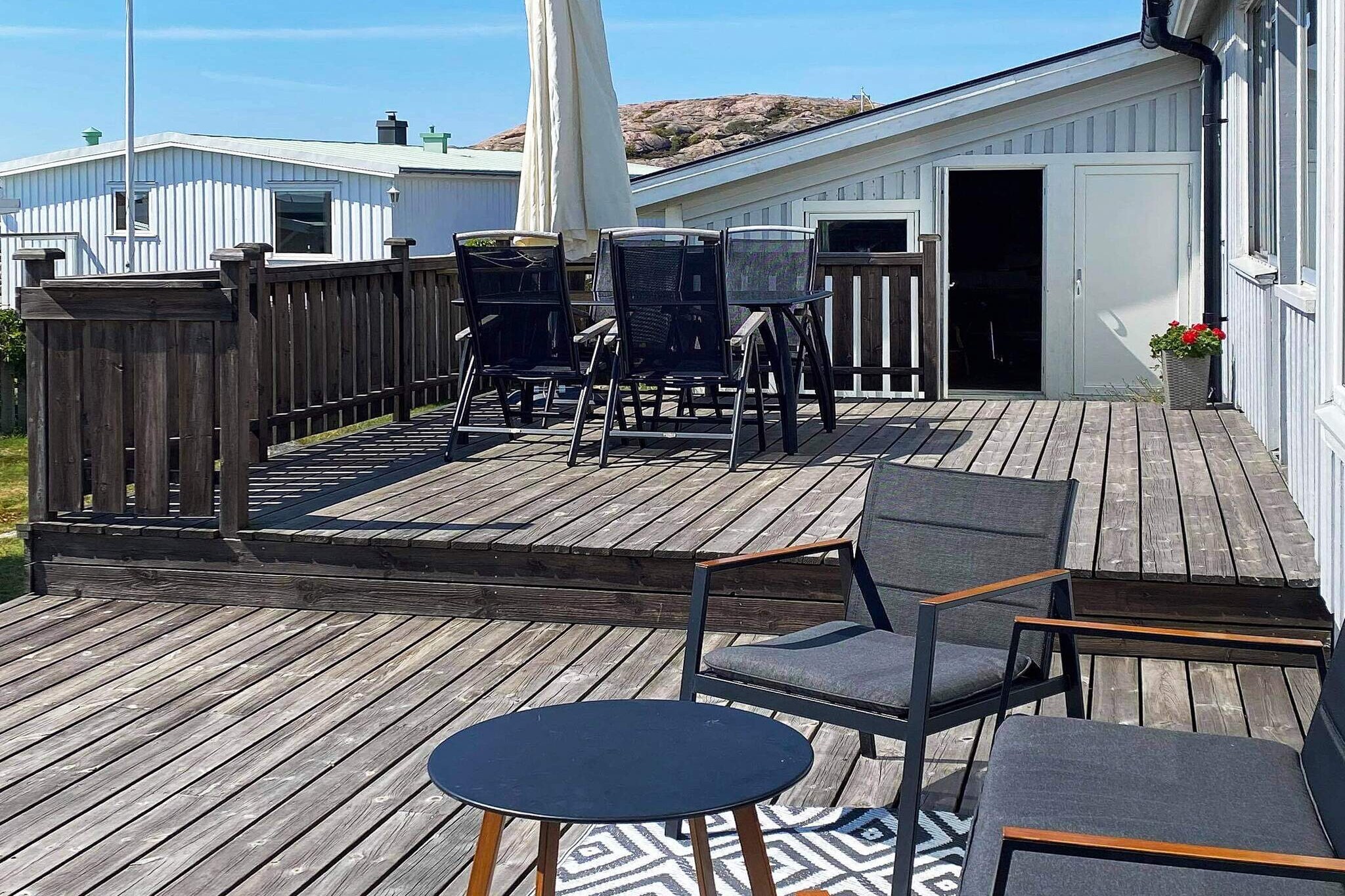 open kitchen(cooker(electric), coffee machine, microwave, dishwasher, fridge-freezer), Living/bed room(TV, fireplace, radio), bedroom(double bed), bedroom(2x bunk bed), bedroom(double bed), bedroom(2x bunk bed), bedroom(double bed), bedroom(2x bunk bed), bathroom(floor heating)(washbasin, shower, toilet, washing machine), bathroom(washbasin, shower, toilet), heating(electric), terrace, terrace(roofed), garden furniture, BBQ, parking