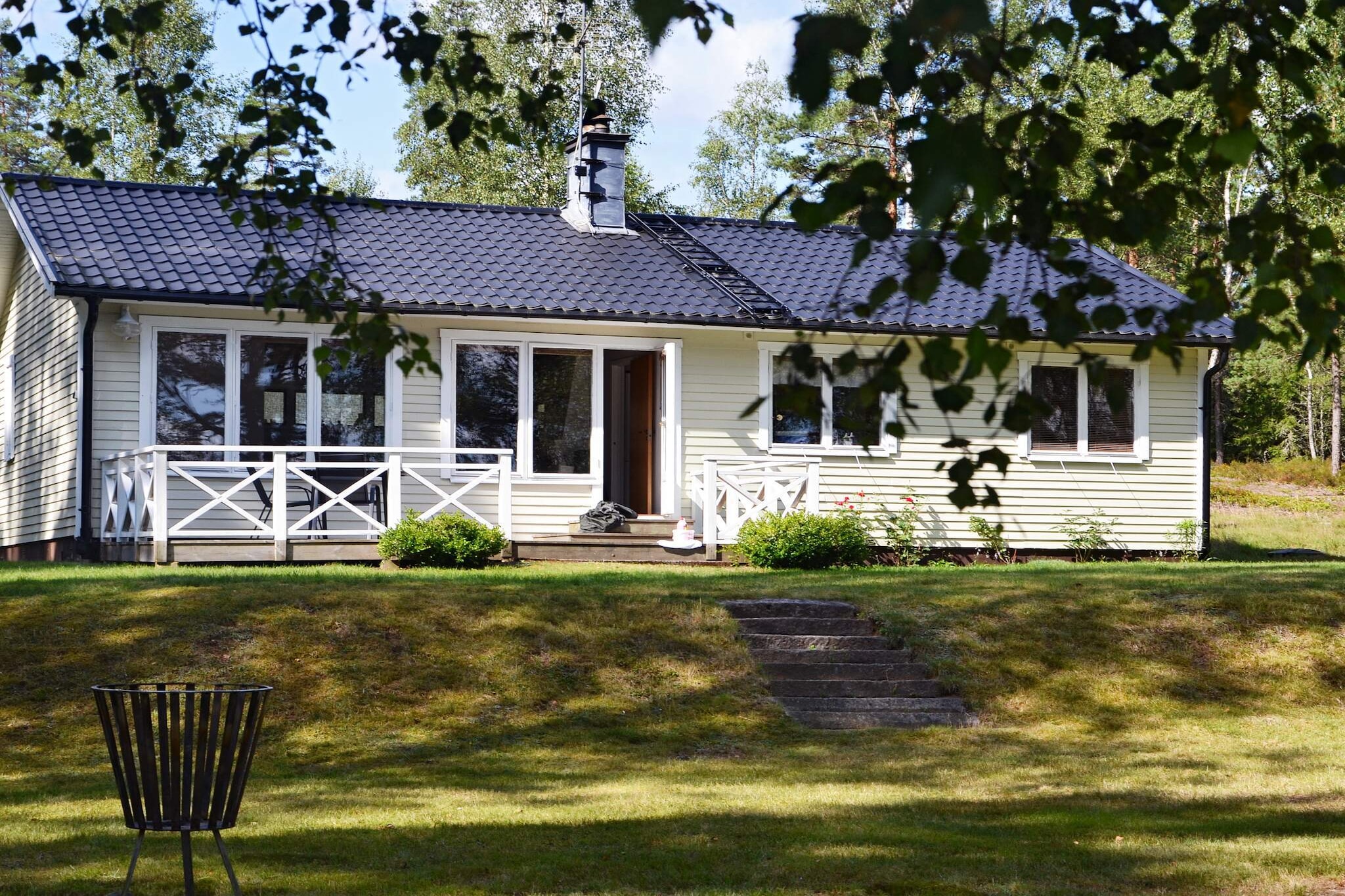 Right in the heart of Småland, in the quiet Småland forests, there is plenty to do for the adventurous at the same time as the lakes and the surrounding forests provide fantastic opportunities for peaceful relaxation. With this cottage you really have the perfect starting point. Here you live in a cozy, spacious cottage just a stone's throw from your own beach edge. Explore the beautiful lake from the boat or canoe included in the rent. Enjoy the view of the lake from your terrace or inside from the cozy living room with fireplace that has the same lovely views.There is wifi in the house. If you want to go on an adventure, there is, as I said, an enormous amount to experience nearby. Only 6km away you will find Isaberg Mountain Resort with bike paths, toboggan run, hiking trails and much more. You can easily get there by bike path from the cottage to Isaberg if you like cycling on your holiday. (www.isaberg.com) There is something for all tastes and levels and is well worth a visit, or more! In the winter when it snows, Isaberg also has a ski slope, but regardless of the season, there are plenty of things to do here. For those who appreciate hiking and want to see a little more than just the beautiful nature around the cottage, you can get to Store Mosse Nature Reserve about 30km away. Here are many nice hiking trails and fantastic nature to see (www.storemosse.se) Good to know Final cleaning can be purchased on site directly from the home owner. Cleaning cannot be pre-ordered. There are German TV channels. During the summer, those traveling with children can take the opportunity to visit High Chaparral, which is a wild western experience for the whole family. All in a genuine Wild West environment with bison, train wrecks, wheeled steamers, gold panning, cowboys, shows and theater and much, much more. (www.highchaparral.se) For those interested in golf, Isaberg Golf Club is only 8 km away. The golf club has 2 18 hole golf courses, as well as a 6 hole short hole course which is a Pay & Play course. (www.isaberggolf.se) If you want a more culinary experience, you will find Hestraviken restaurant only 6 km away, which is a restaurant with fresh seasonal ingredients that are often from the area and nature's own pantry. Cooking has its roots in the Swedish tradition and draws inspiration from Mediterranean cuisine. (www.hestraviken.se) The cottage is rented to groups of 4, which can be divided into up to 3 bedrooms if desired. In the left part of the cottage you will find the spacious bathroom and 2 bedrooms, one with a double bed with a beautiful view of the lake and one with a bunk bed. Furthermore, you enter the kitchen where the dining area has the same wonderful view. You have a large spacious living room with dining area, great views and a fireplace. From this room you also reach the third bedroom with two single beds. You have your own beach, where you will find both the boat and the canoe. Here you get a fantastic holiday, regardless of whether you come in the wonderful Swedish summer or one of the other beautiful seasons!