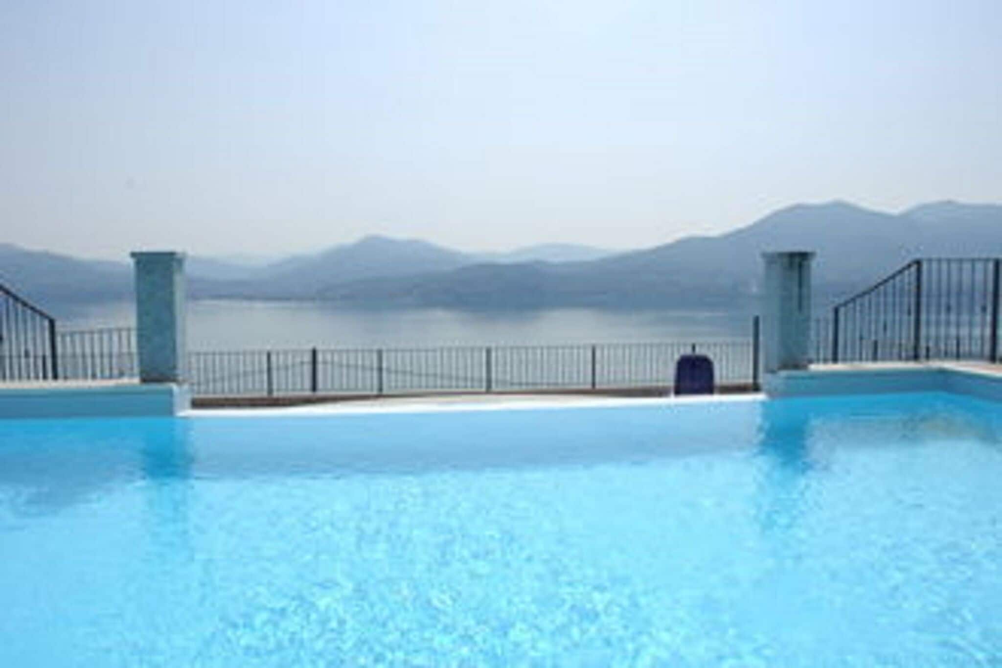 Lakeview apartment in Oggebbio with swimming pool