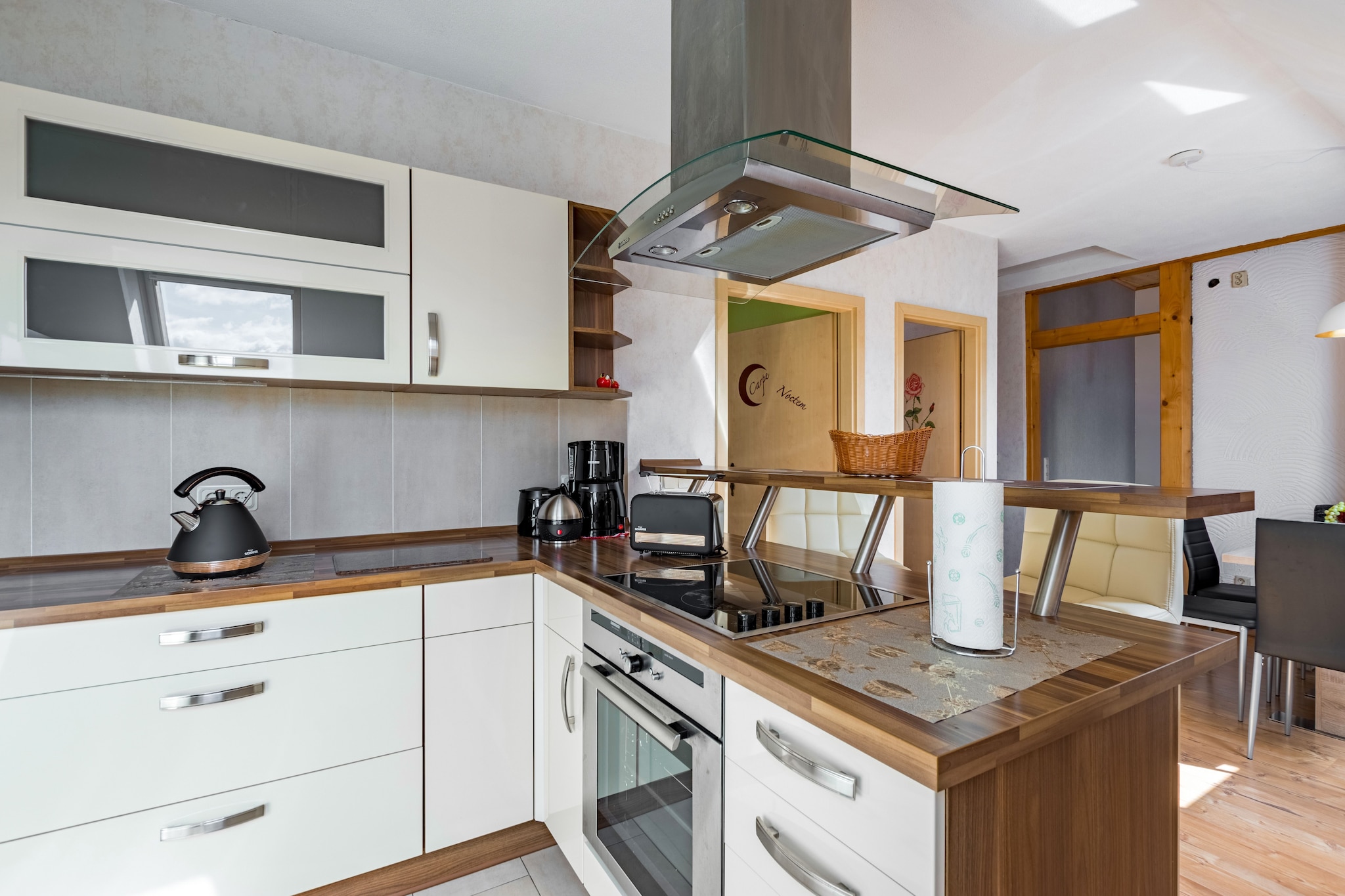 On the 1st floor: (open kitchen(bar, electric kettle, toaster, cooker(4 ring stoves, ceramic), hood, coffee machine(filter), oven, microwave, dishwasher, fridge), Living/diningroom(TV(flatscreen, satellite), dining table, fireplace, seating area), bedroom(double bed(180 x 200 cm)), bedroom(single bed(90 x 200 cm), single bed(90 x 200 cm)), bathroom(bath tub, shower, washbasin, toilet))\n\ncot, washing machine(paid), balcony, heating(gas, wood), BBQ(on request), parking, high chair, iron, party games, Sunscreen