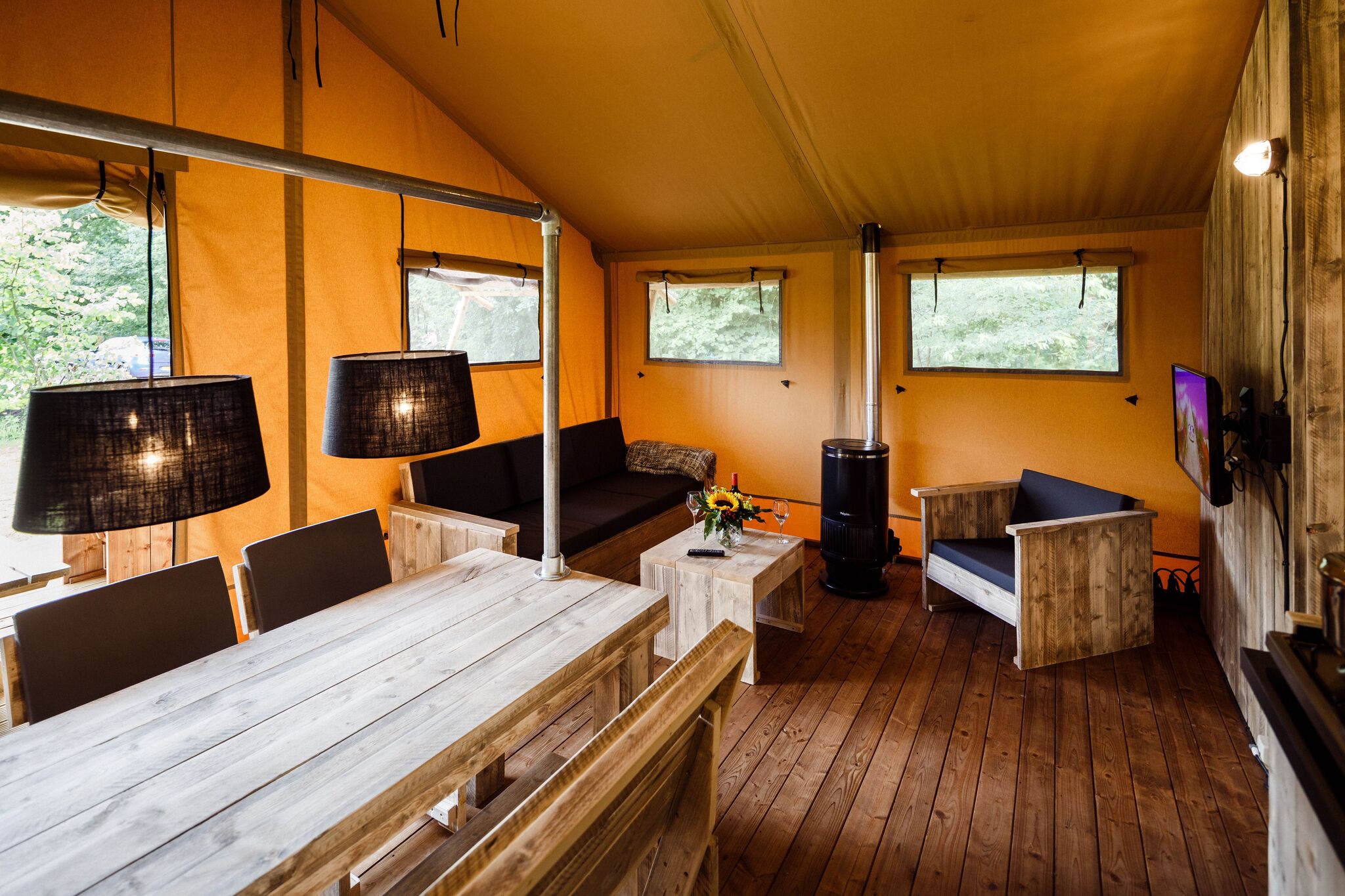 Atmospheric glamping tent with bathroom in nature