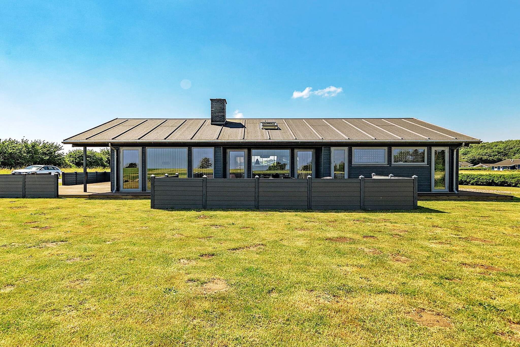 This bright holiday home with a whirlpool and sauna is located in the attractive holiday area on the outskirts of Spodsbjerg. The entrance hall leads to a bathroom with a whirlpool and sauna as well as a bedroom. From here you also enter the spacious open-plan kitchen and living area, designed for family gatherings. The room features an open ceiling to the ridge, skylights, a generous kitchen with cooking island, and access to both east- and west-facing terraces. A large loft (hems) provides extra space, while underfloor heating runs throughout the entire house for year-round comfort. The property includes four well-furnished bedrooms and two bathrooms, one with a washing machine and dryer. Entertainment options include a PlayStation 2 with various games. A modern air-to-air heat pump with cooling function ensures a pleasant indoor climate. Large windows in the kitchen/living area provide lovely views over the green surroundings and out to the water, where you can watch the busy ship traffic pass by. Just 300 m away lies a child-friendly beach at Spodsbjerg Drej, perfect for family swimming trips. The area is also well known as a popular fishing spot. No rentals to youth or tradesmen groups are permitted, ensuring a peaceful and family-friendly atmosphere.A refundable deposit might be charged closer to your check-in date. The security deposit ensures a smooth stay and covers any additional services or consumption charges.This deposit covers utilities consumed during your stay and any additional services that may be taken.The final amount will be adjusted based on actual meter readings, actual usage of extra services, and any remaining balance will be refunded within 21 days after checkout.This deposit simply acts as a prepayment for charges that  you would anyways pay for, ensuring a seamless stay and check-out experience.