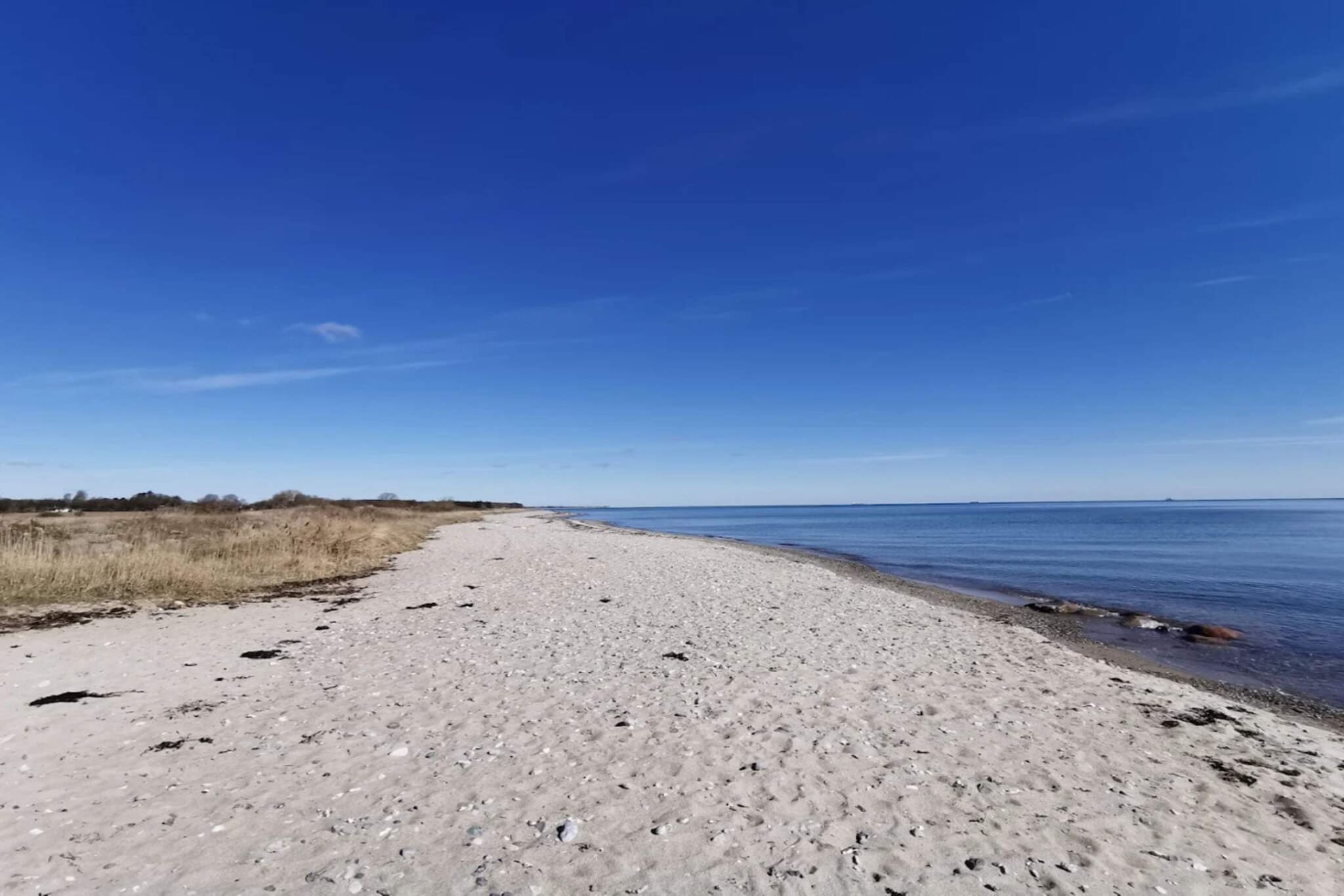Vakantiehuis aan de kust met spa en sauna - Waterzicht