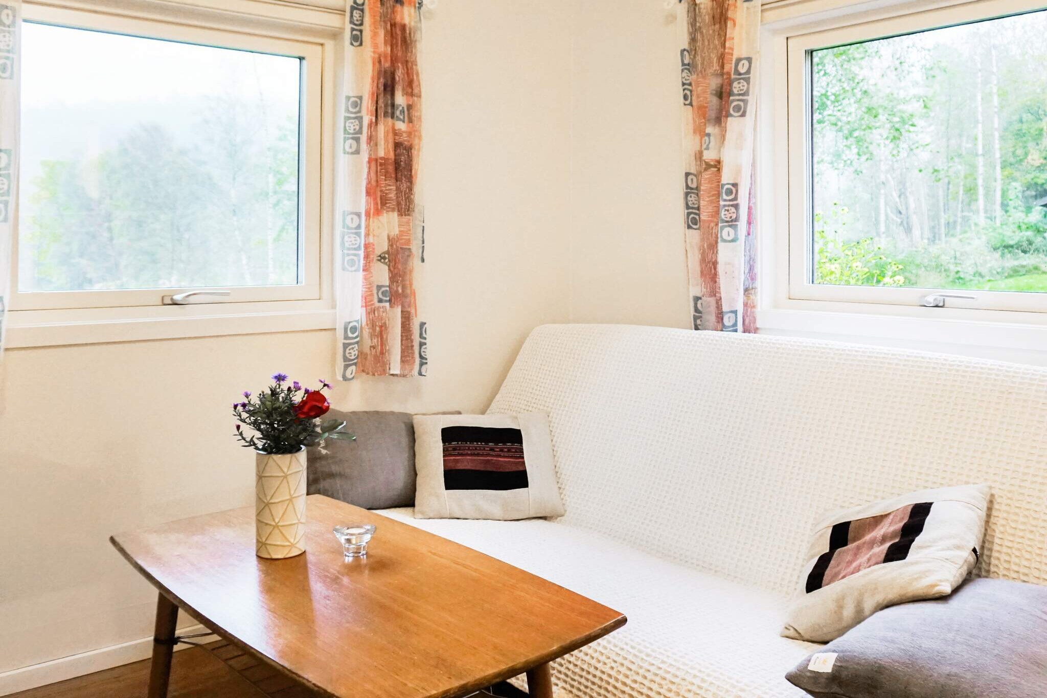 Kitchen(cooker(electric), coffee machine, microwave, fridge-freezer, high chair), Living/bed room(single folding bed, chromecast), bedroom(2x bunk bed), bathroom(washbasin, shower, toilet), heating(electric), courtyard(garden furniture, BBQ)