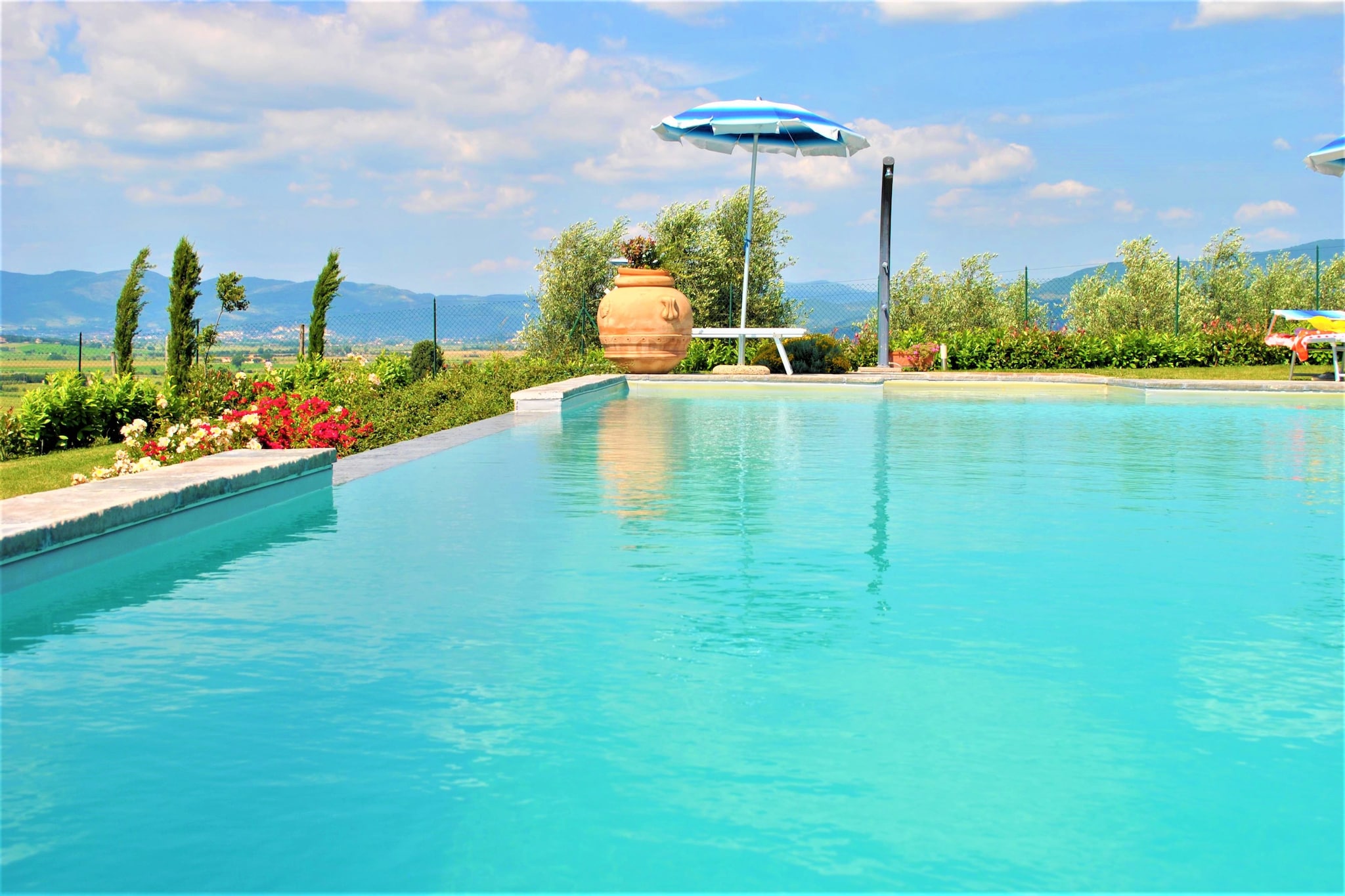 This beautiful detached villa of 180 mÂ² in Cortona in Tuscany has a private swimming pool and a comfortable terrace. It is the ideal choice for holidays with 1 or 2 families.

We are in the heart of the Valdichiana in a panoramic position from where you can enjoy the beautiful view of the surrounding landscape and the Leopoldine. In the immediate vicinity, you will find numerous historic farms from the seventeenth century, built by the Grand Duke Pietro Leopoldo di Lorena. Cortona is 14 km away and a visit to Montepulciano at 25 km is also very worthwhile.

Relax in the garden shed with an attractive design or enjoy a refreshing dip in the private swimming pool. The villa is part of a farm where oil, wine, honey and different types of seasonal fruit are grown. The terracotta floors and the authentic fireplace ensure a magical atmosphere in this beautiful stay.
