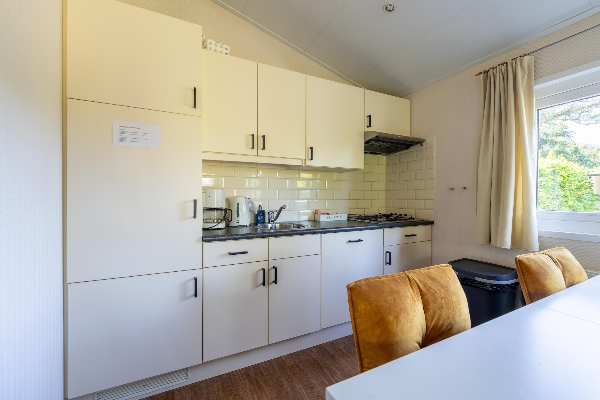 Ground floor: (Living room(TV, seating area), Kitchen(coffee machine, combination microwave, microwave, dishwasher, fridge), bedroom(bunk bed), bedroom(double bed), bathroom(shower, washbasin, toilet))\n\ntumble dryer, washing machine, patio, heating, air conditioning, terrace, garden, garden furniture, BBQ, parking, trampoline, swimming pool(shared with other guests, outside), swimming pool(shared with other guests, indoor), play equipment(shared with other guests), ironing board, party games