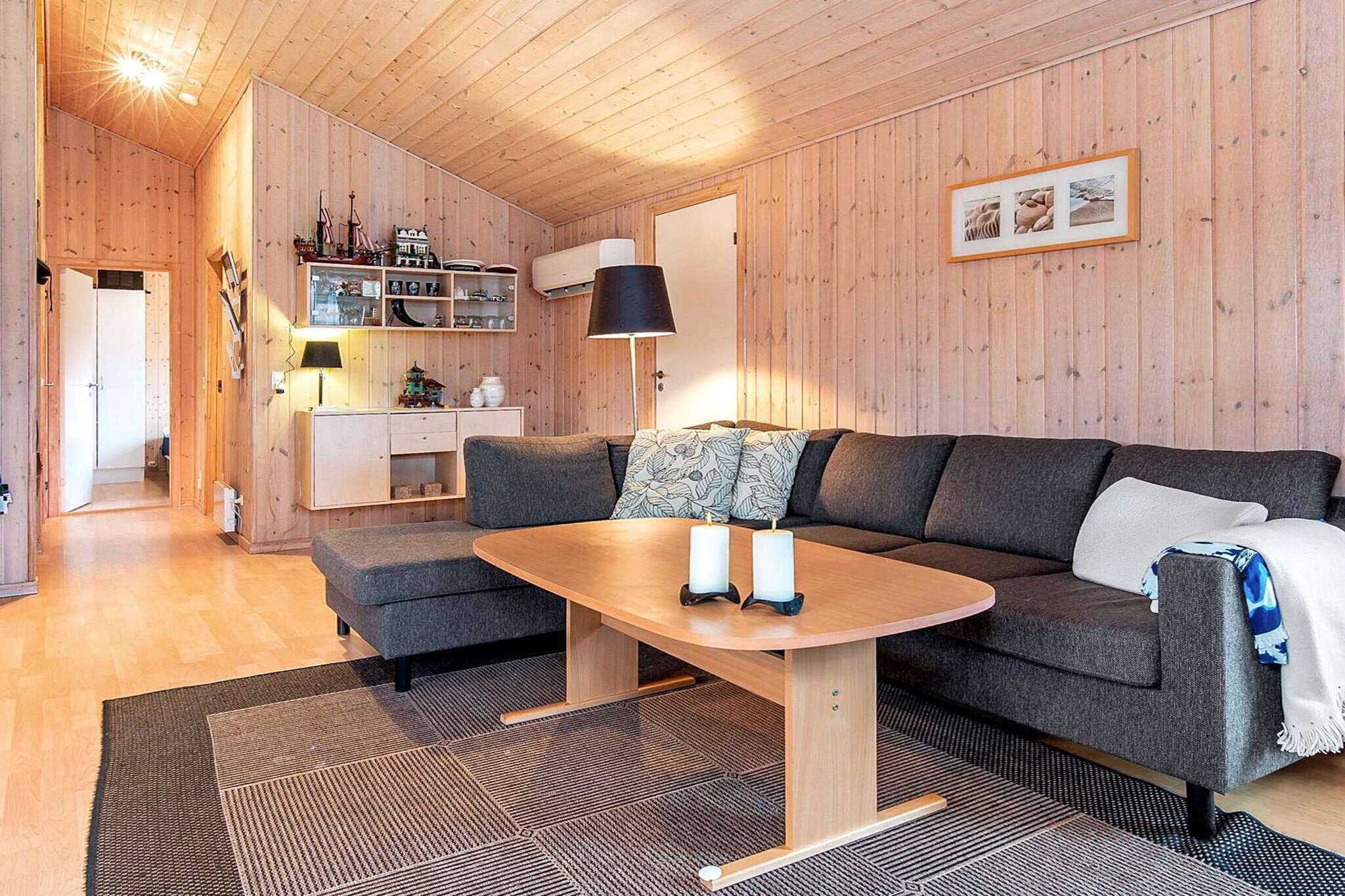 Just a short walk from the sandy beach at HÃ¸ll, this holiday home is the kind of place where family memories are made. Its relaxed setting, surrounded by greenery, feels both peaceful and welcoming, while the child-friendly lawn outside quickly turns into a playground of laughter and games. Inside, the cozy living room opens directly to the terrace and garden, making it easy to flow between sunlit mornings outdoors and quiet evenings indoors. Whether itâ€™s breakfast in the fresh air or watching the kids chase a ball across the grass, life here moves at an unhurried pace.

The house is designed with comfort in mind. After a day by the sea, you can unwind in the private whirlpool or soothe tired muscles in the sauna. Simple pleasures become part of every day: sharing meals around the table, enjoying the glow of the afternoon light through the windows, or stepping out to the terrace as the evening settles in. With plenty of space and a welcoming atmosphere, it is an ideal retreat for families looking to balance activity and relaxation.

The location adds to its charm. The seaside is only a stroll away, and during the summer months a restaurant just 200 meters from the house offers a convenient spot for a casual meal. When youâ€™re ready for an excursion, the towns of Vejle and Fredericia are within easy reach, offering shops, culture, and coastal experiences. Yet back at the house, the sense of calm returns â€“ a private garden, the fresh sea air, and the comfort of a home built for togetherness. Please note that rentals are not available to youth groups.