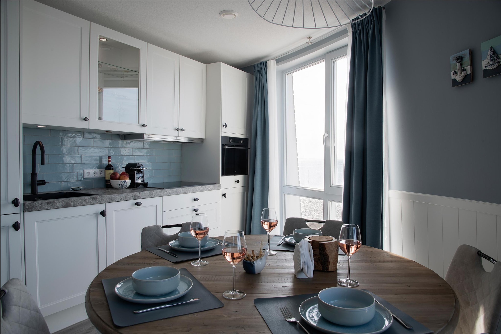 On the 2nd floor: (open kitchen(hob(4 ring stoves, induction), hood, coffee machine, combination microwave, dishwasher, fridge), Living/diningroom(TV(flatscreen, smart TV, dutch television channels, german television channels, international television channels), dining table, seating area, air conditioning), bedroom(double bed(boxspring), TV(flatscreen, smart TV)), bedroom(double bed(boxspring)), bathroom(shower, infrared sauna, washbasin), toilet(washbasin))\n\ntumble dryer, washing machine, balcony, parking, lift, lounge set, Charging post for electric cars