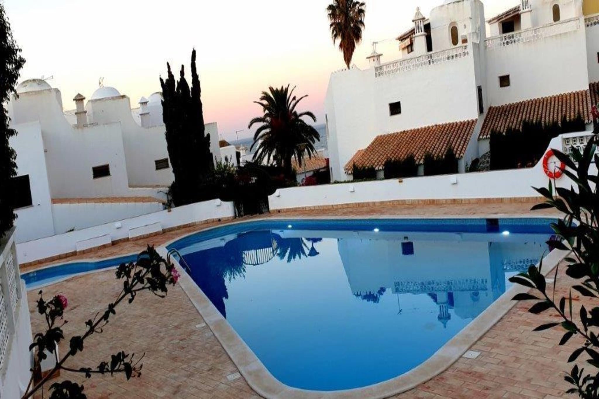 "Terraced house close to the beach in a pretty residential complex with communal pool. From the roof terrace you can enjoy a breathtaking view of the Atlantic. In the shared swimming pool, you can enjoy refreshing dips before having a tasty meal in the well-furnished garden. The home is ideal for a vacation with family or friends. 
From the area of the residential complex, stairs lead directly to the sandy beach, which is only 100 m away. The centre is 1.5 km away from where you can shop. Enjoy the watersports activities 2 km away. At the same distance, you can enjoy horseback riding. If tennis excites you then the tennis court is 1 km away. 
The beautiful house has a wonderful kitchen where you can prepare delicious meals. From the balcony, you can admire the scenic views. The bedrooms are perfect for providing the peaceful sleep. There is a washing machine for your convenience. 
""About Belvilla :
""""At Belvilla, you experience holidays exactly the way you want. Choose from an extensive range of holiday homes, apartments and caravan parks from Europe to Florida. From a cabin by the Norwegian fjord to an exclusive villa on the Côte d'Azur, and from an apartment in Rome to a country estate in Tuscany. At Belvilla you will find the perfect holiday home for an unforgettable time with your family, partner or friends. You will also find holiday homes for larger groups, spread across various regions in Europe.
Belvilla offers a wide variety of holiday homes: small and cosy with a sauna or spacious with an outdoor pool, roof terrace and numerous bedrooms. At Belvilla, for example, you can choose from holiday homes in prime locations, with luxury amenities and homes particularly suitable for families. Of course, many holiday homes also have a space reserved for your dog. You can choose from practical holiday homes in popular holiday destinations, city houses in cosmopolitan cities such as Venice or Rome, dreamy holiday homes in top locations and spacious holiday homes with unique furnishings. Besides holiday homes by the sea, Belvilla also offers holiday homes with swimming pool and/or wellness facilities."
