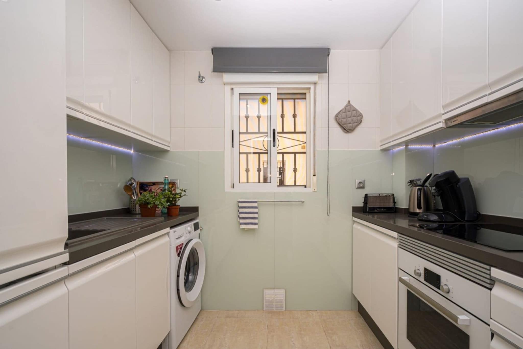 Ground floor: (Living room(TV, seating area), dining room(dining table), Kitchen(cooker, coffee machine, oven, microwave, fridge-freezer), bedroom(double bed), bedroom(double bed), bathroom(shower, washbasin), bathroom(shower, washbasin), balcony, roof terrace)\n\nair conditioning, terrace, parking, swimming pool(shared with other guests)