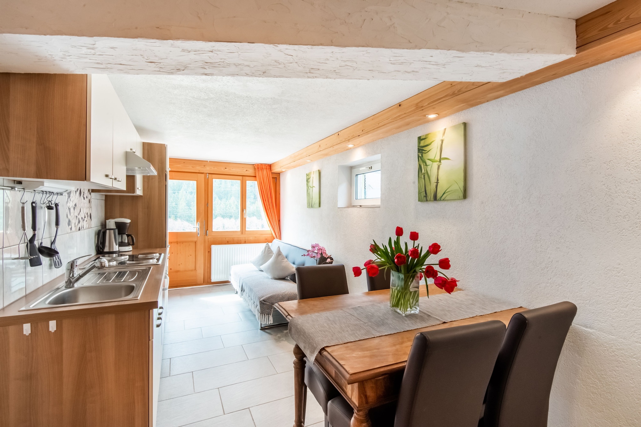 Ground floor: (Kitchen(TV(satellite), dining table, seating area, electric kettle, coffee machine, oven, dishwasher, fridge), bedroom(double bed), bedroom(2x single bed), bathroom(shower, washbasin, toilet))\n\nski storage, dishwasher, washing machine, ski boot heaters, terrace, garden, parking