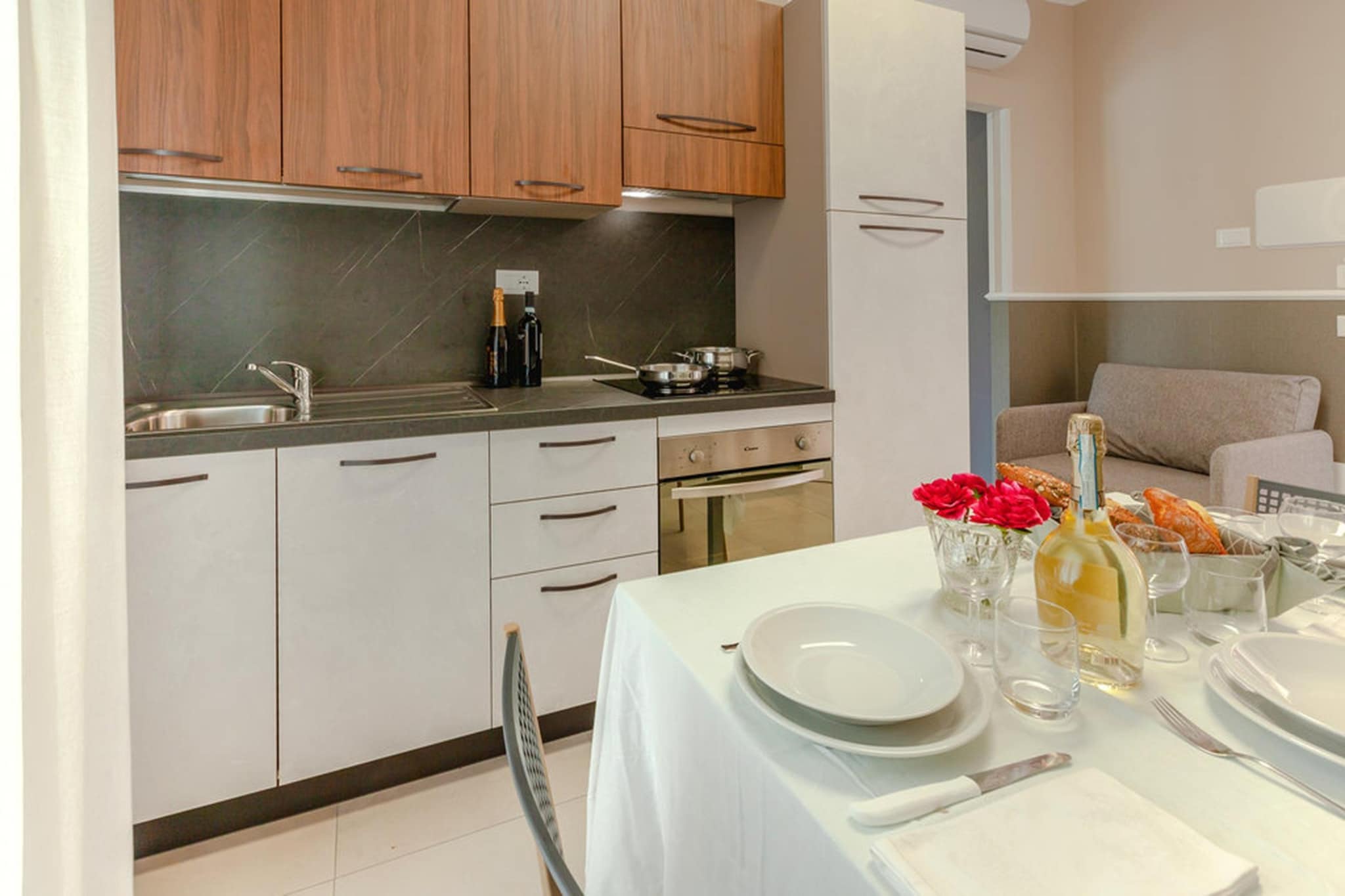 On the 1st floor: (open kitchen(hob, hood, oven, fridge, washbasin), Living/diningroom(single sofa bed, dining table, balcony or terrace), bedroom(double bed), bathroom(shower, washbasin, toilet, bidet), air conditioning)\n\nwashing room(washing machine(shared with other guests)), Bubble bath(shared with other guests, outside), garden(shared with other guests, fenced), garden furniture, sun loungers, BBQ(shared with other guests), parking, swimming pool(shared with other guests, outside, opened from 1/2 Jun upto and including 1/2 Sep), play equipment, table tennis table, bicycles available(paid)