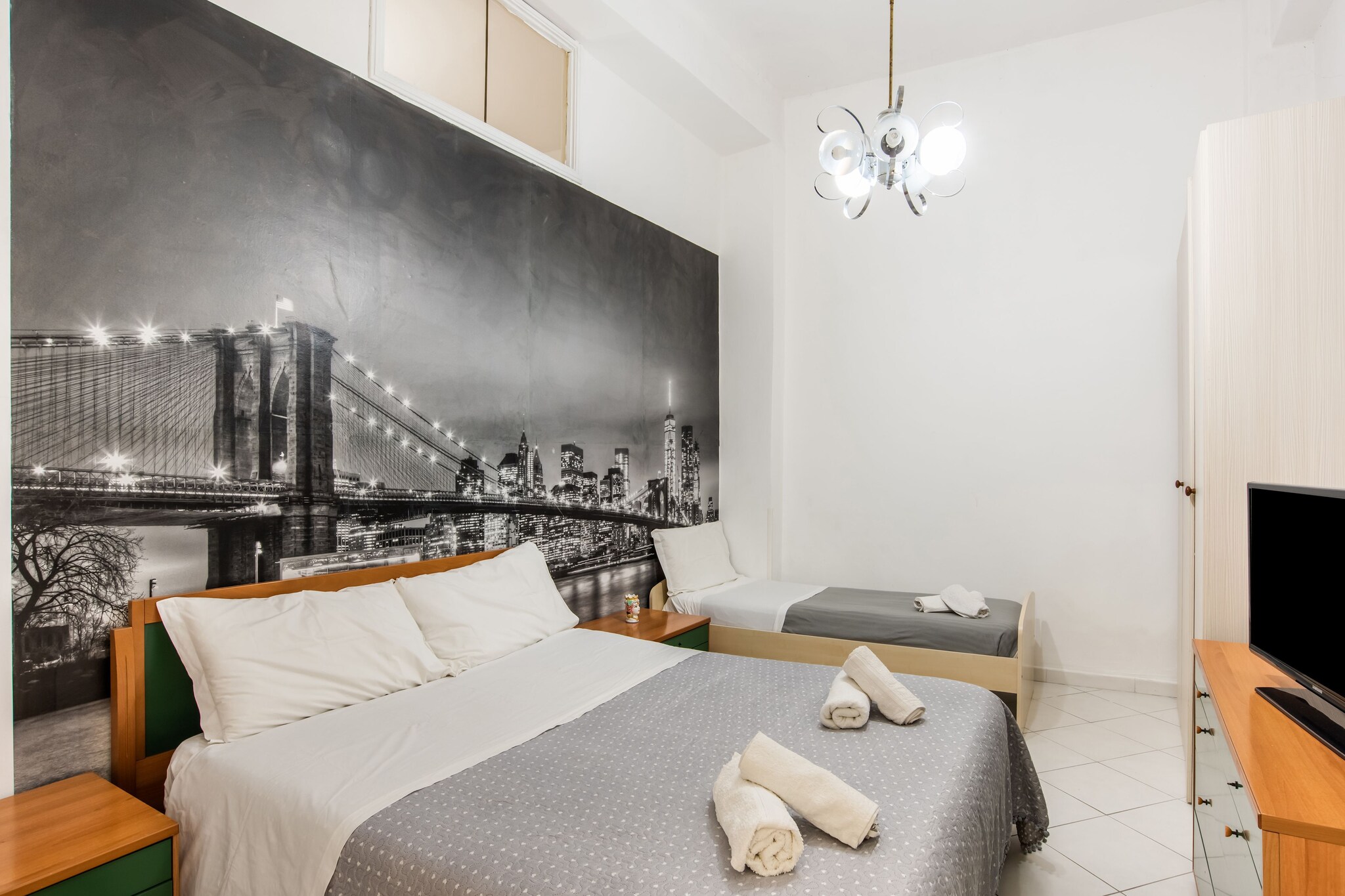 Ground floor: (Entrance, Living room(single sofa bed, TV, dining table), Kitchen(single box bed, hob, hood, coffee machine, oven, microwave, fridge-freezer, washing machine), bedroom(double bed), bedroom(double bed), bedroom(double bed or 2 single beds), bathroom(shower, washbasin, toilet, bidet), bathroom(shower, washbasin, toilet, bidet))\n\nwood cooker, patio, garden, garden furniture, BBQ, parking