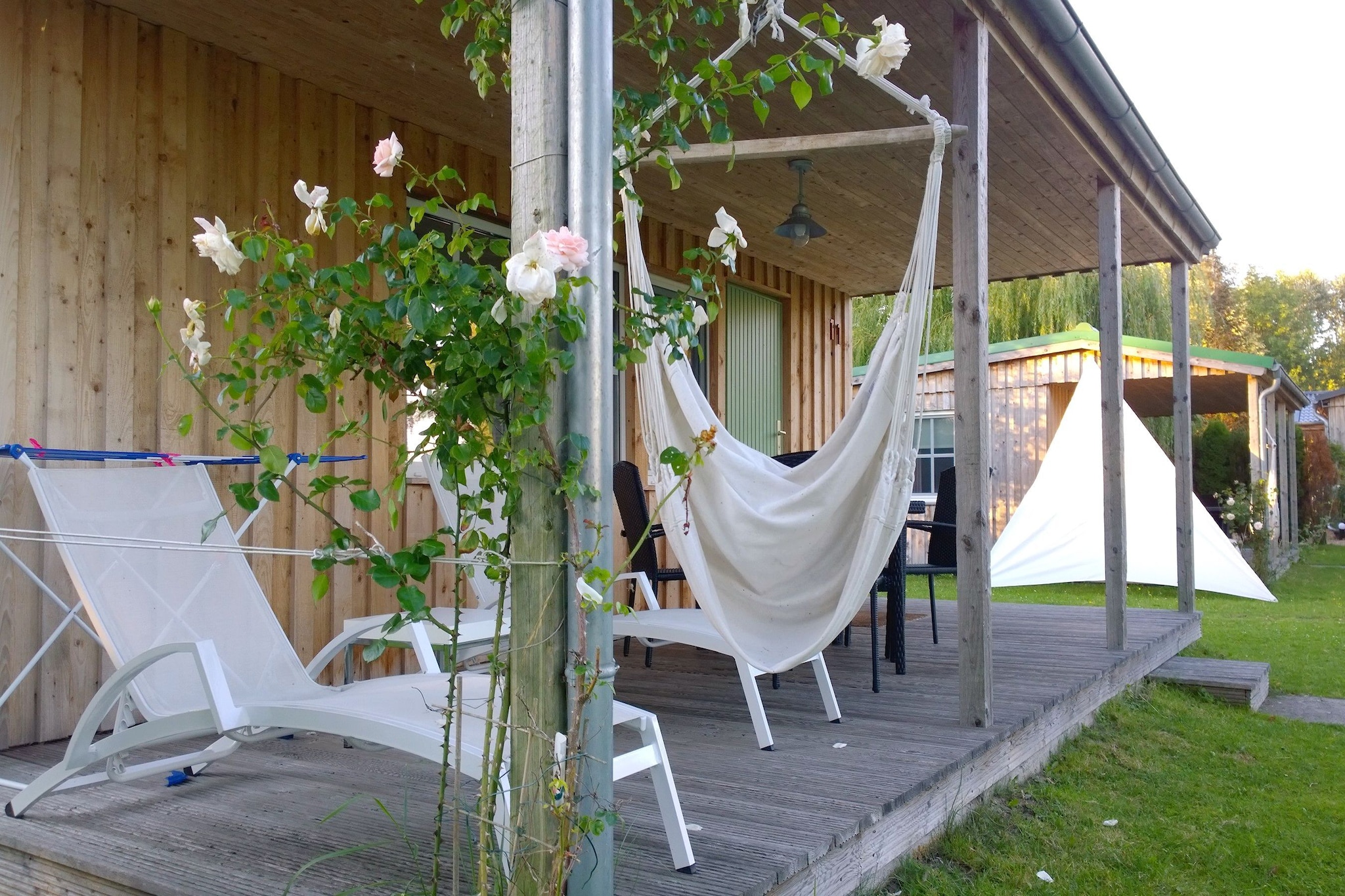 Ground floor: (open kitchen(hob(2 ring stoves, ceramic), electric kettle, toaster, coffee machine, fridge(+ freezer)), Living/diningroom(double sofa bed, TV(satellite), dining table, fireplace), bedroom(single bed, single bed), bathroom(shower, washbasin, toilet))\n\nBarbecue center, Parking, heating(electric), terrace(roofed), garden furniture, sun loungers, high chair, baby crib(paid), Towels/Sheets (extra fee)