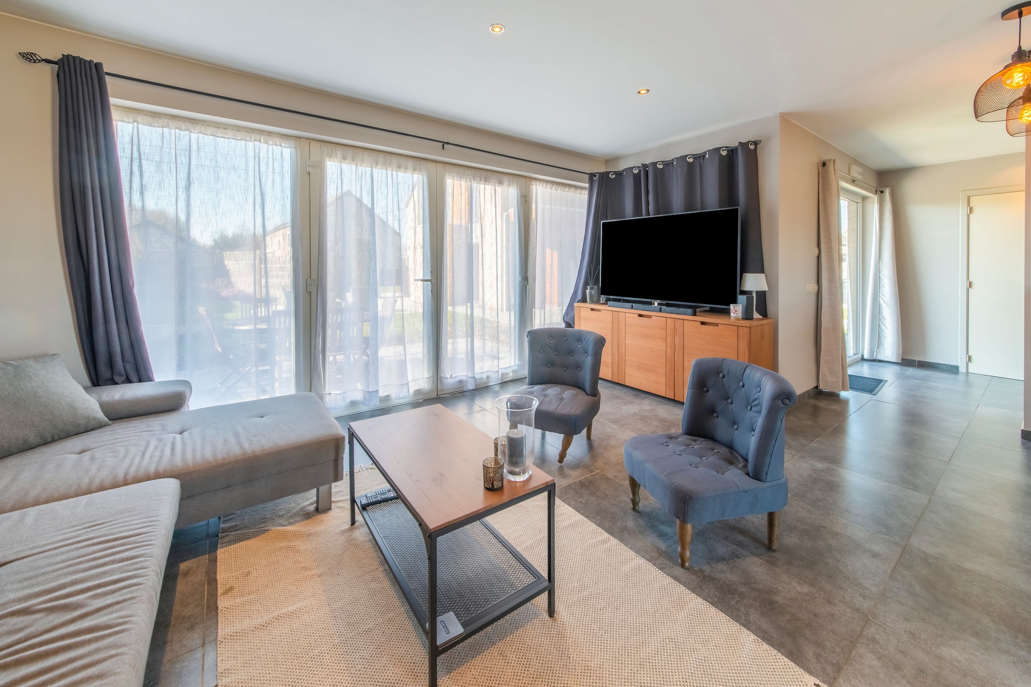 Ground floor: (Living room(TV, dining table, seating area), Kitchen(cooker, coffee machine, oven, microwave), bedroom(double bed), bedroom(double bed), bathroom(shower, washbasin))\n\nterrace, BBQ, parking