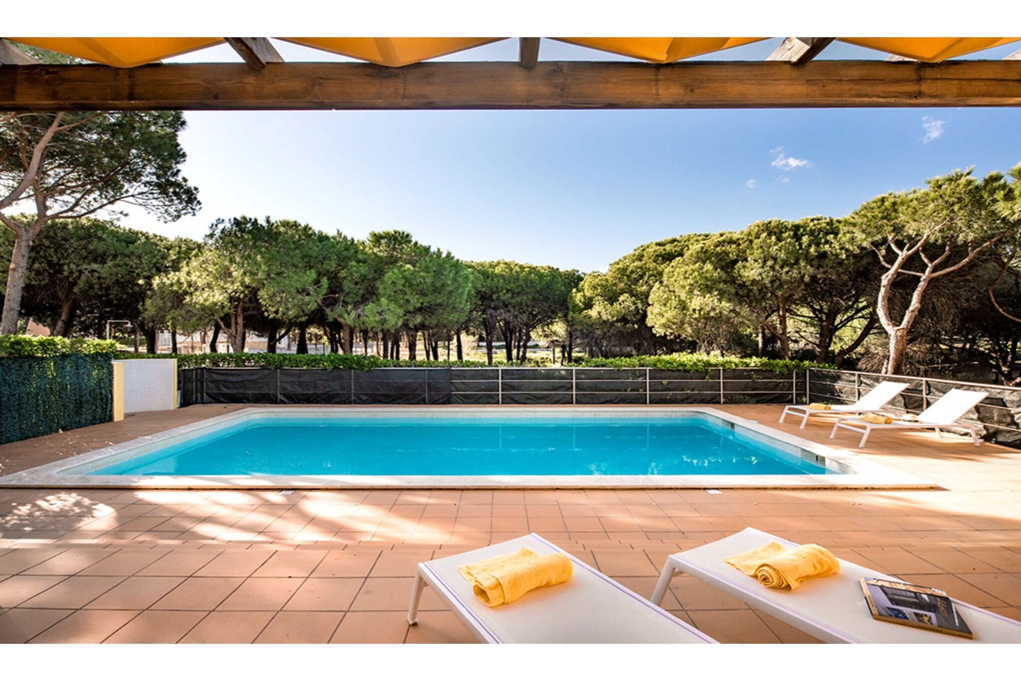 Ground floor: (Living room(TV(international television channels), seating area), Kitchen(toaster, cooker(gas), coffee machine, oven, dishwasher, fridge-freezer), Bedroom with bathroom(double bed, bath tub), Bedroom with bathroom(double bed, shower), Bedroom with bathroom(double bed, shower), Bedroom with bathroom(2x single bed, shower), Bedroom with bathroom(2x bunk bed, shower))\n\ngarage, washing machine, air conditioning, terrace(private, roofed), roof terrace, garden(private), garden furniture, sun loungers, BBQ, parking, swimming pool(private), lounge set