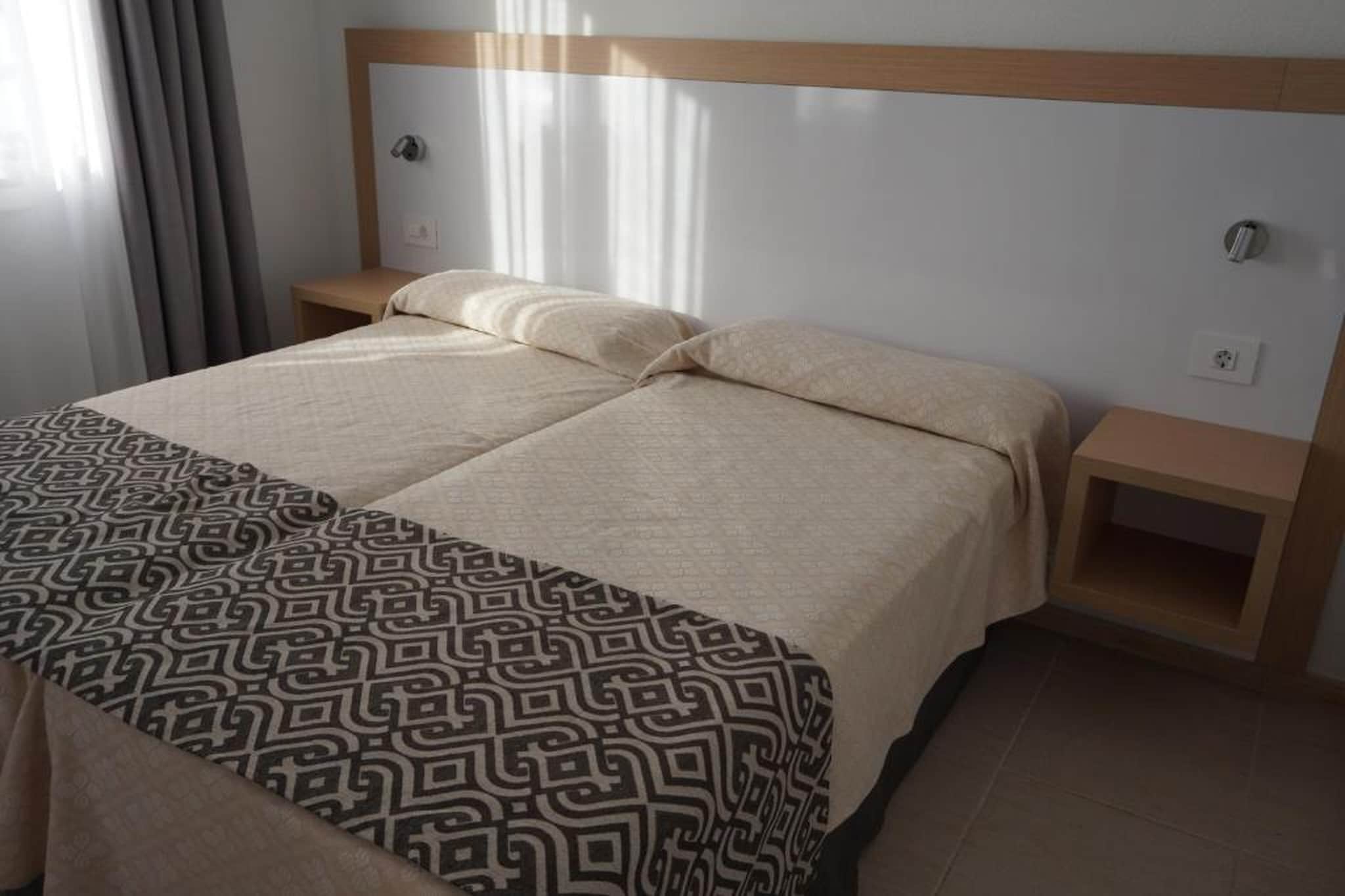 This pleasant apartment on Tenerife is blessed with a pleasant location, close to the sea. It is ideal for sun holidays with family or friends.
Spend your days in the sun or visit to nearby places such as Puerto de Santiago and the picturesque Tamaimo. You can hit a ball at Buenavista Golf and Paisaje Lunar El Teno Alto forms a beautiful decor for Insta-worthy photos. Other interesting sights on Tenerife are: the El Teide volcano, water park Siam Park and Loro Parque zoo.
The apartment offers access to a communal swimming pool. The simply furnished kitchen offers you the opportunity to prepare delicious dishes and you can end the evening with a snack and a drink on the balcony or terrace.
About Belvilla
When you stay in a Belvilla home, you can rest assured of a unique holiday home in ideal surroundings at an attractive price. The portfolio of accommodations consists of more than 40,000-holiday homes in 20 European countries. Interested in a weekend getaway, a summer or winter sports holiday or simply a short break? Do you prefer the coast, the countryside or the mountains? Whatever your preference, there is a Belvilla home to meet your needs, from a cosy gîte for two to a castle big enough for the entire family, from an apartment in the heart of Rome to a cabin in the middle of nowhere, from a simple tree house to a luxury dream villa and from close to home to the other side of Europe.
A Belvilla home gives you the freedom to enjoy breakfast in your pyjamas or continue a good conversation into the morning hours without having to worry about the bar's closing time. Prepare gourmet meals with fresh local ingredients in your own kitchen and take advantage of having your own swimming pool to do as many cannonballs as you want! In other words, you can enjoy complete privacy in your home away from home.