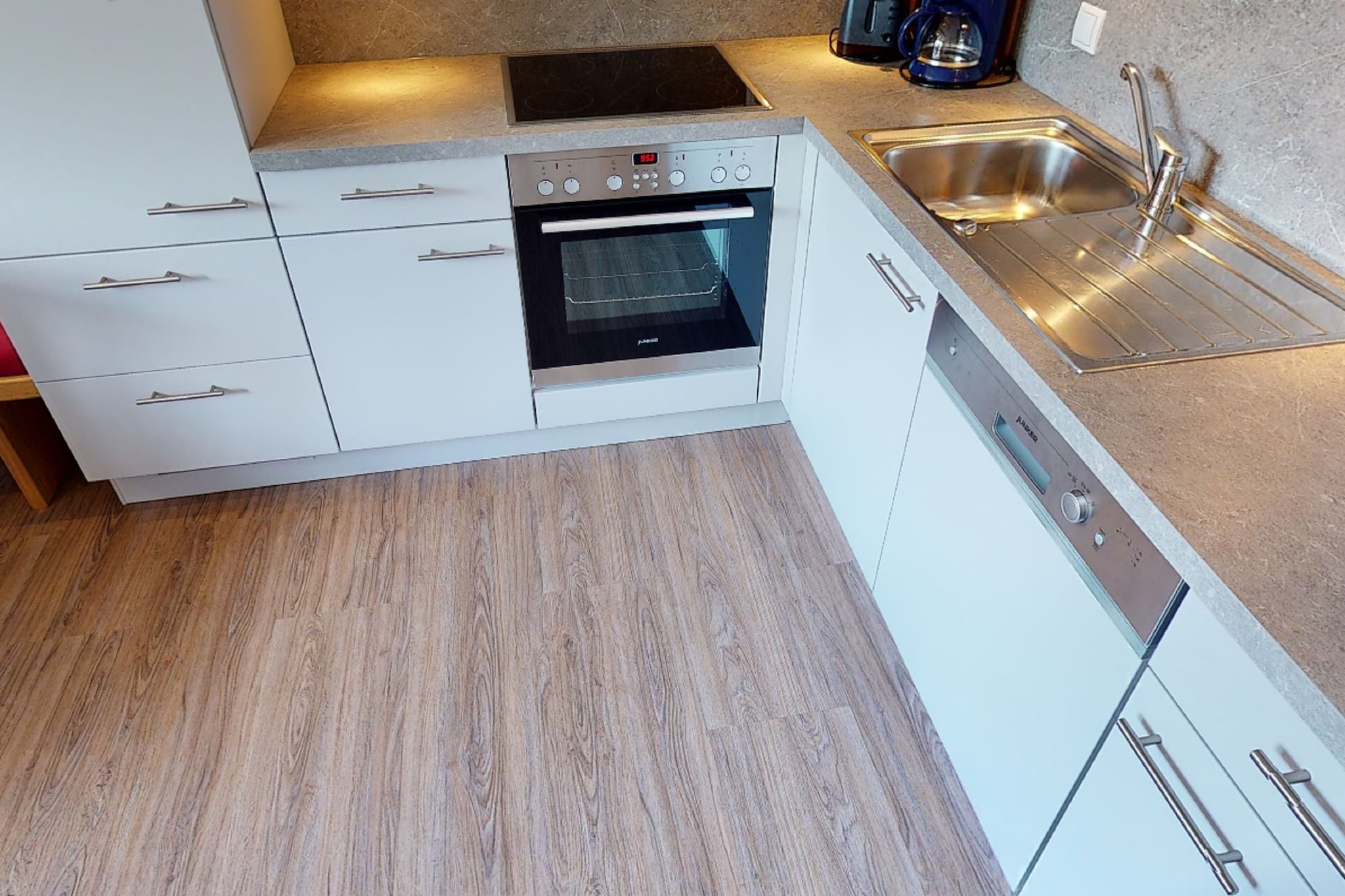 On the 1st floor: (Living room(double sofa bed, TV, dining table, seating area), Kitchen(cooker, coffee machine, oven, microwave, dishwasher, fridge-freezer), bedroom(double bed, bunk bed, TV, balcony), bedroom(double bed, TV, balcony), bathroom(shower, washbasin, toilet))\n\ngarden, BBQ, parking