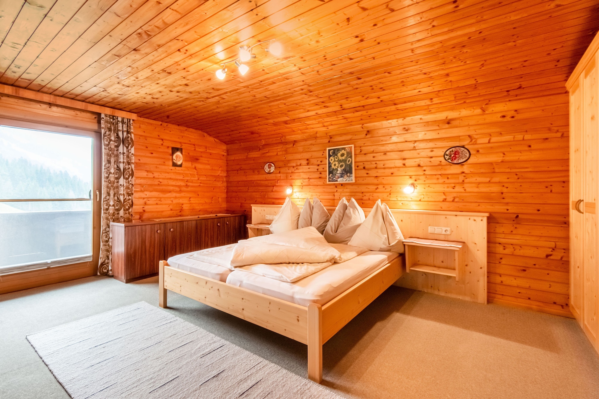 On the 1st floor: (Living room(seating area), Kitchen(toaster, cooker, coffee machine, oven, microwave, dishwasher, fridge-freezer), bedroom(single bed, double bed, washbasin), bedroom(single bed, single fold-away bed, double bed, washbasin), bedroom(double bed, washbasin), bathroom(shower, washbasin, toilet), toilet)\n\nbalcony, terrace, garden, BBQ, parking